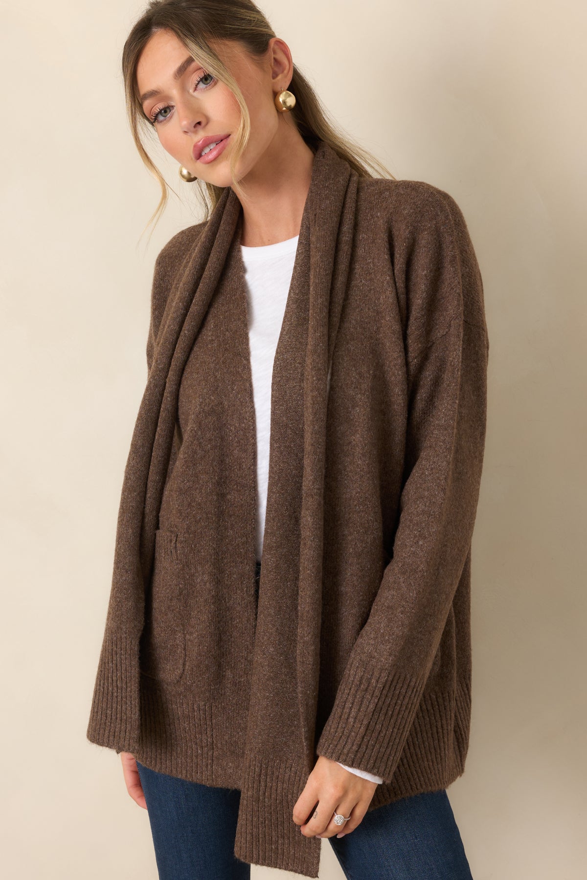 Open-front cardigan with long sleeves and coordinating ribbed trim defining the relaxed silhouette.
