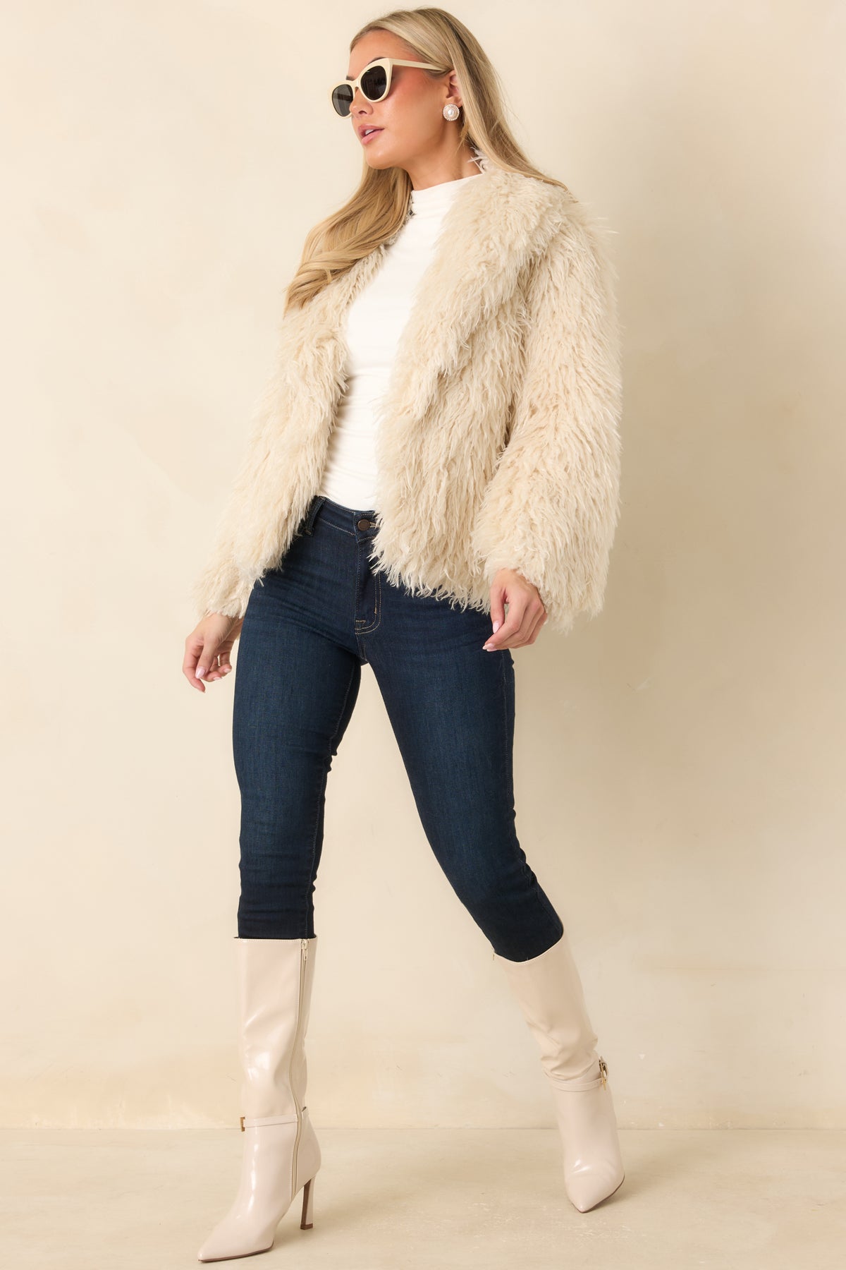 Open-front plush jacket featuring long, wavy fibers and a relaxed shape for comfortable layering.