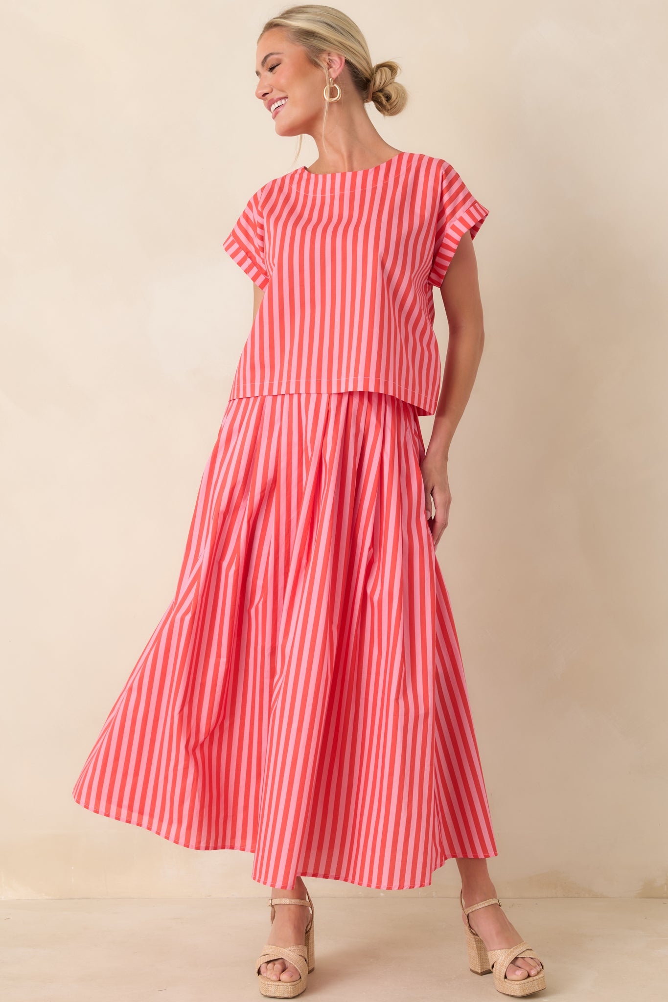 Orange and pink striped cotton top featuring a roomy boxy shape and clean hem with a subtly shortened cut.