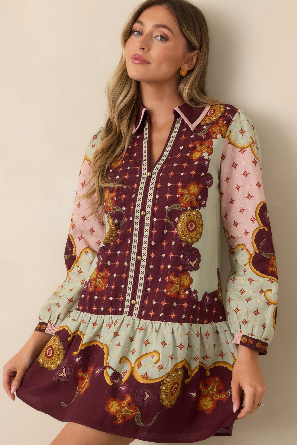 Ornate floral and geometric print dress with a relaxed silhouette and pointed collar.