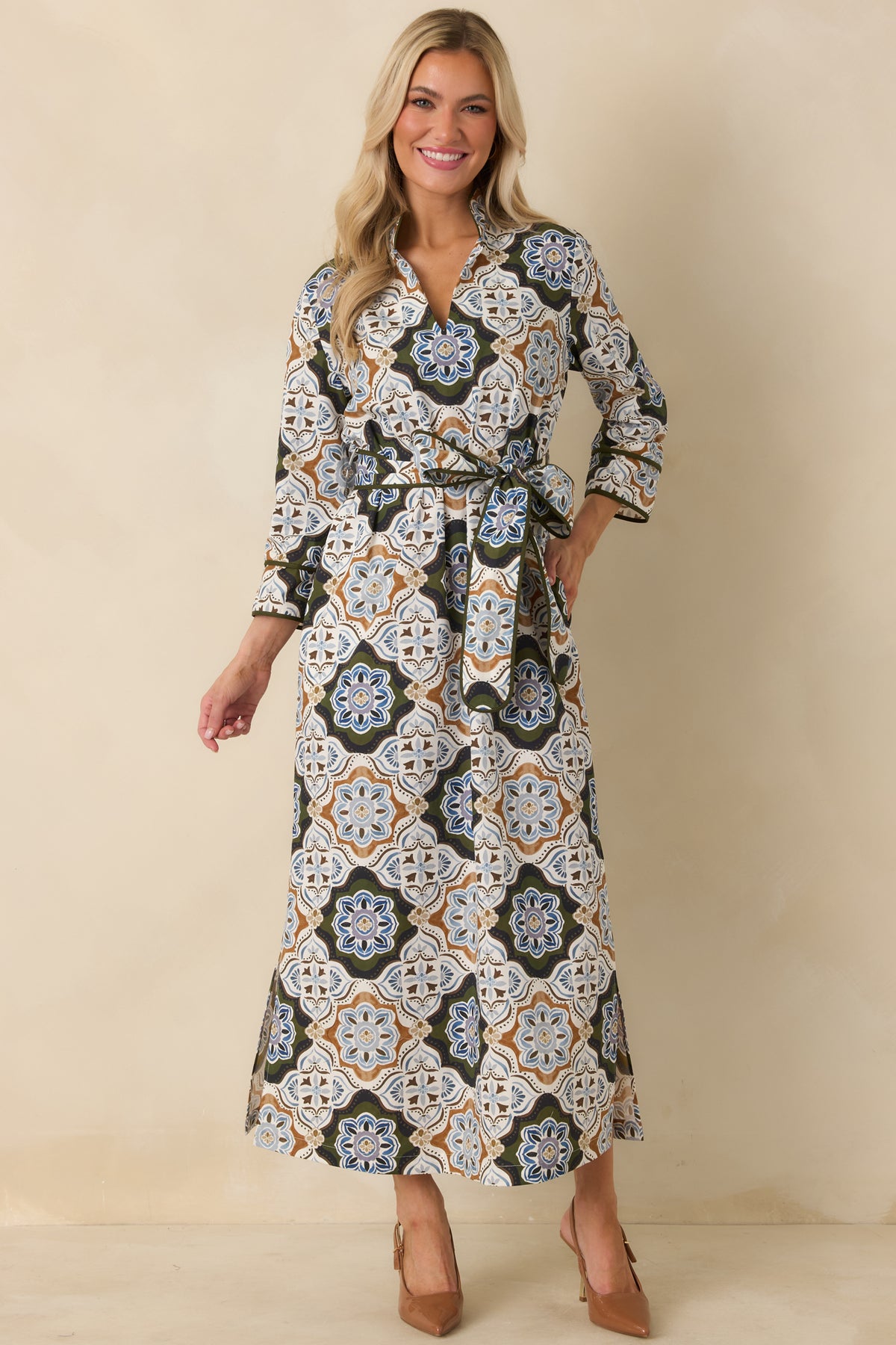 Ornate print maxi dress featuring a structured stand collar, split V-neckline, coordinating self-tie belt, and long relaxed skirt.