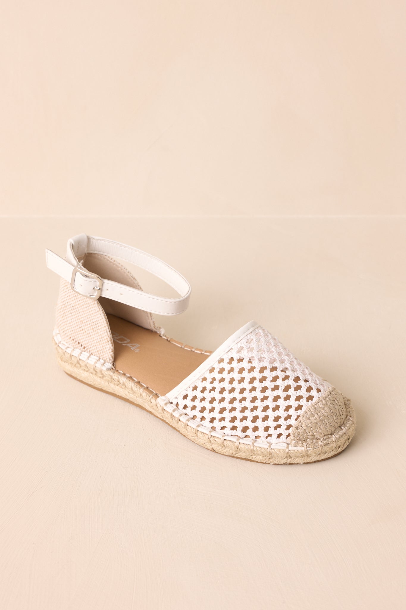 An overhead view of the flats highlighting the woven upper and jute platform.