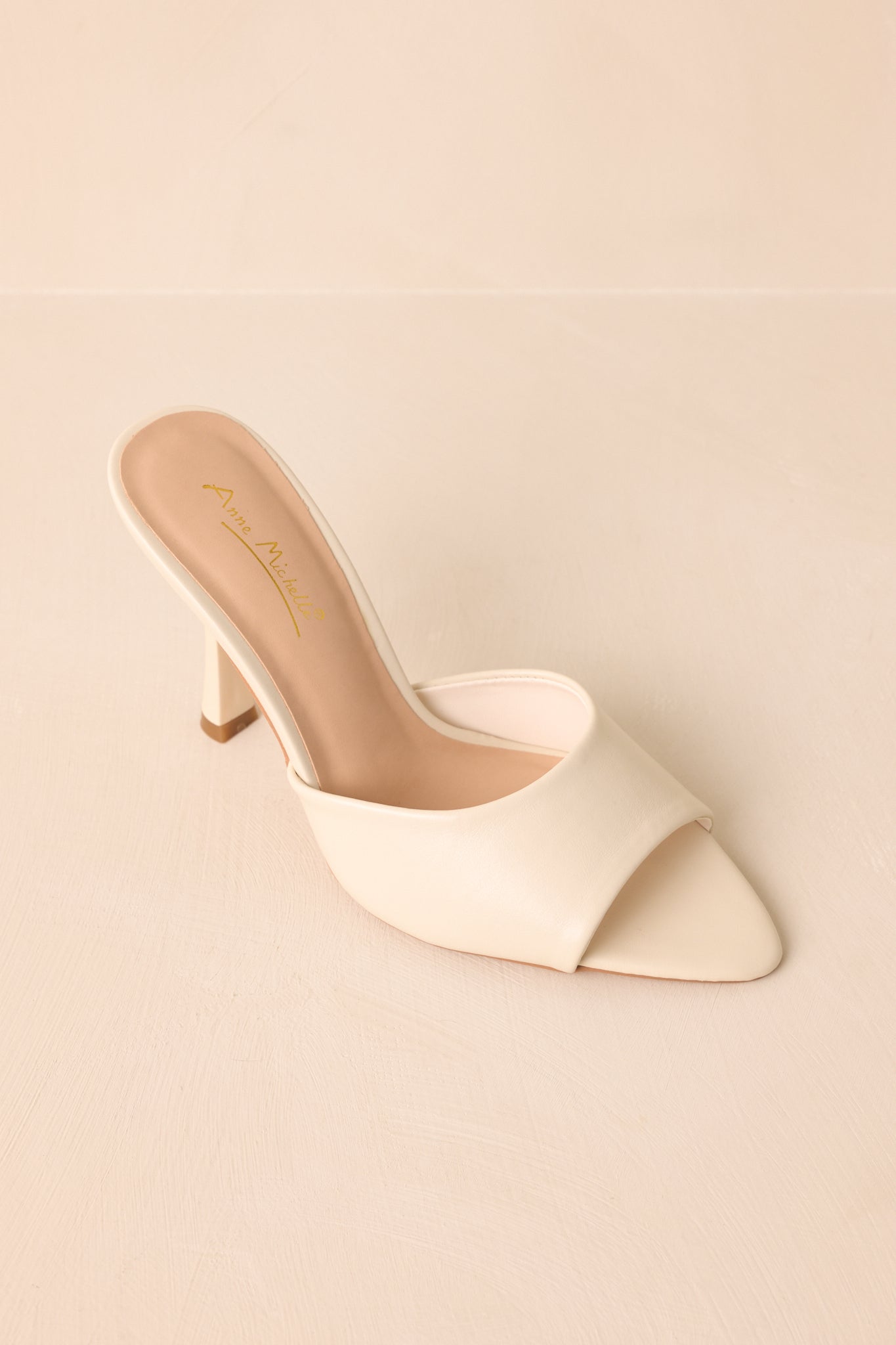 An overhead view of the heels highlighting the open-toe shape and smooth surface.