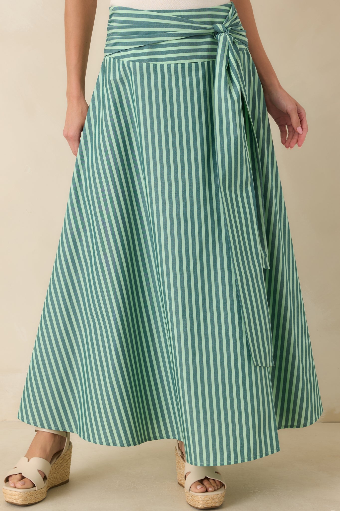 Oversized self-tie sash styled at the waist with lightweight striped cotton fabric creating a polished and feminine finish.