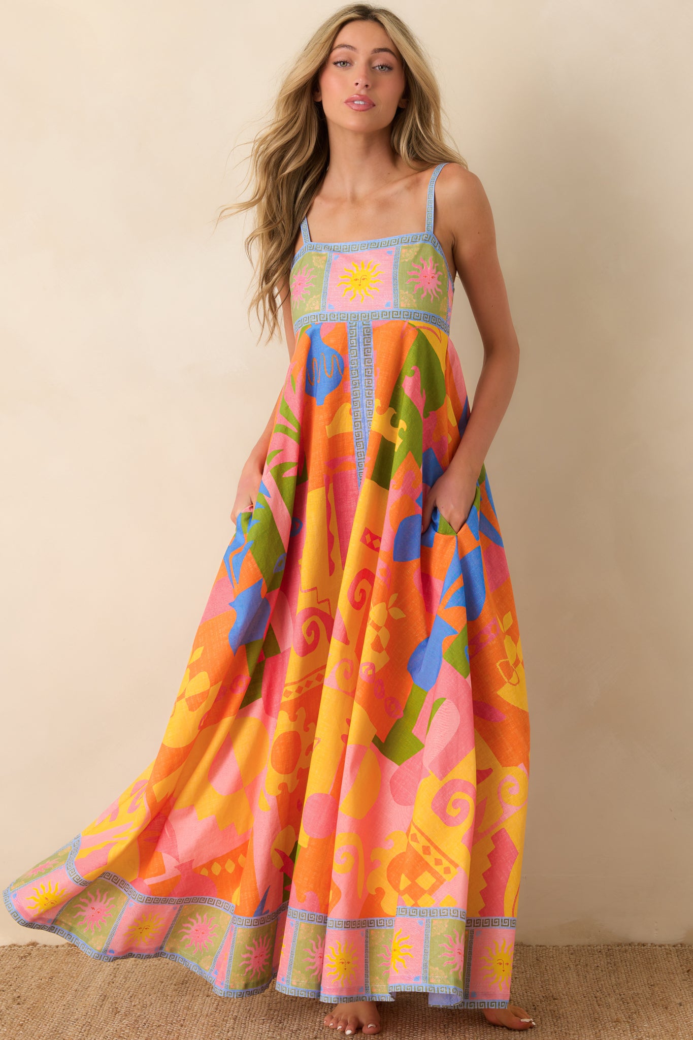 Colorful abstract print maxi dress with airy volume and clean structured seams.
