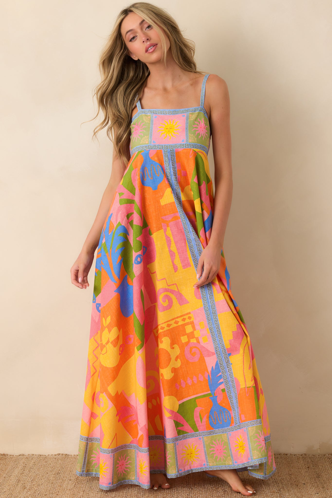 Multi-color abstract print maxi dress with fitted bodice and voluminous skirt.
