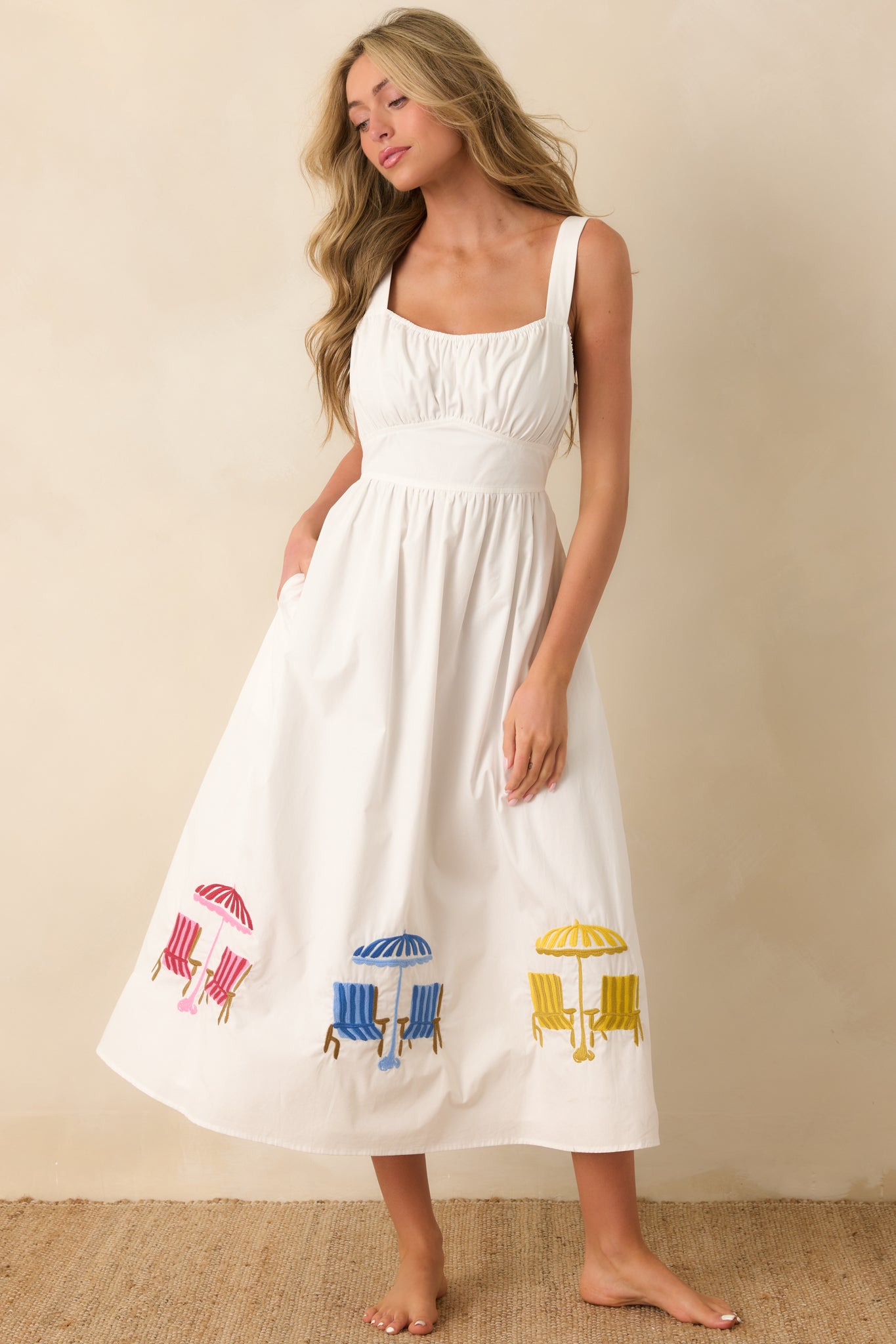 Midi dress featuring a square neckline, softly gathered bodice, and wide waistband that defines the silhouette with a flowy skirt for graceful movement.