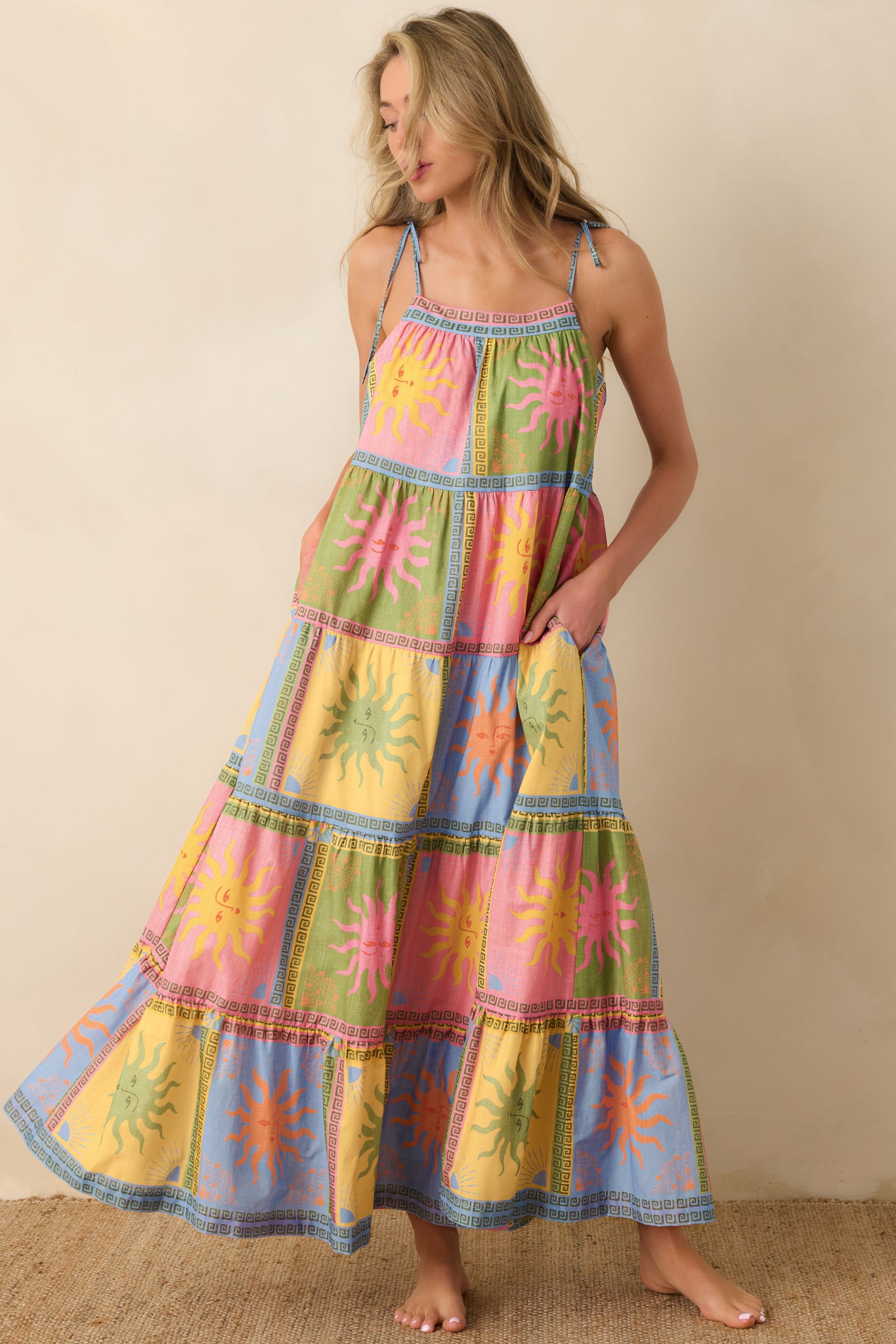 Lightweight cotton voile maxi dress displaying an easy, flowy shape with a gathered waist seam and decorative patchwork detailing throughout.