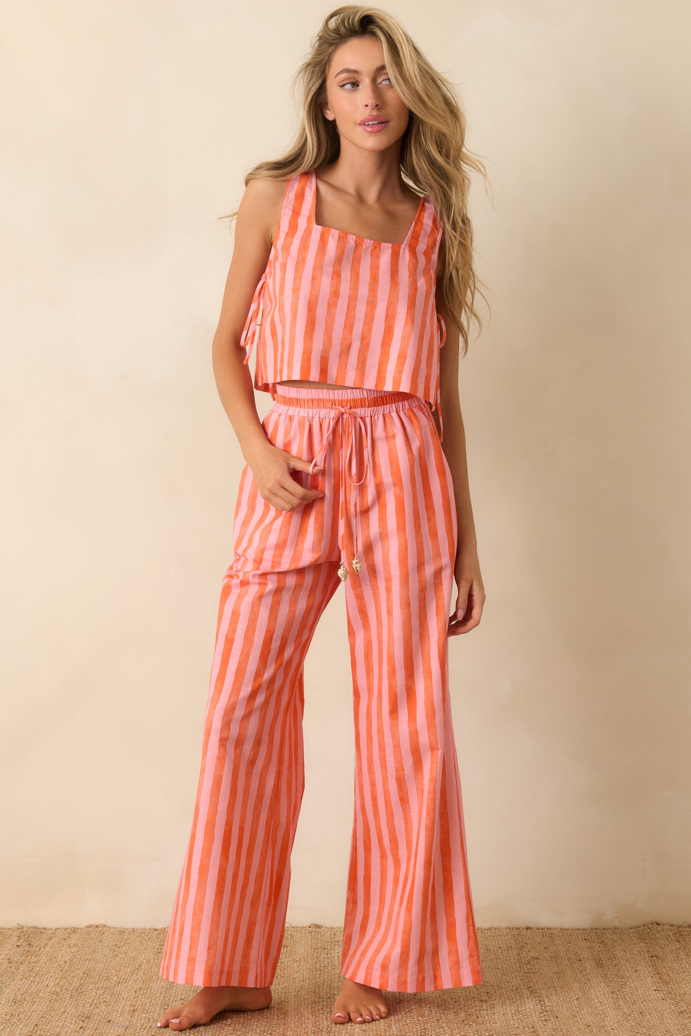 Striped sleeveless crop top showcasing a square neckline and breezy relaxed silhouette.