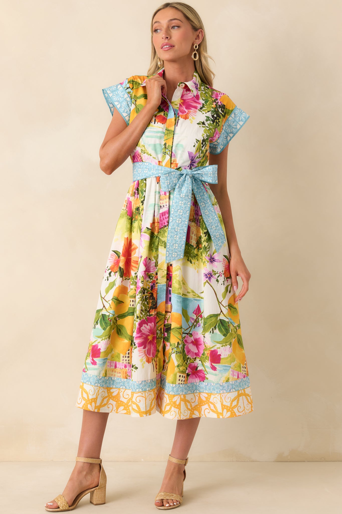 Classic button-front midi dress with cinched waist and contrast trim finish.