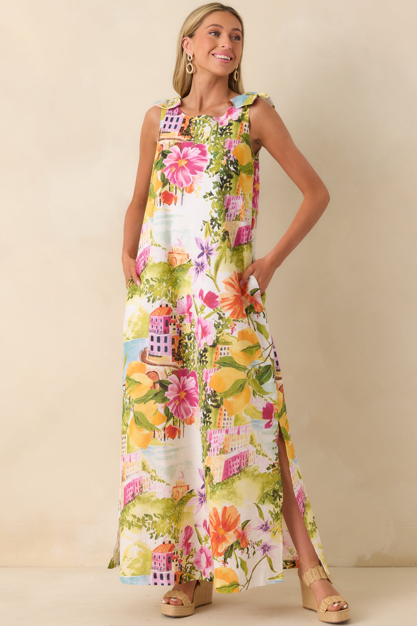 Scenic coastal print maxi dress with flowing silhouette and vibrant seaside pattern.