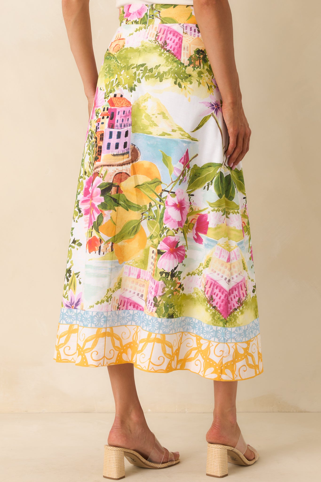 Rear view of high-rise A-line skirt with smooth waistband and softly flared silhouette.

