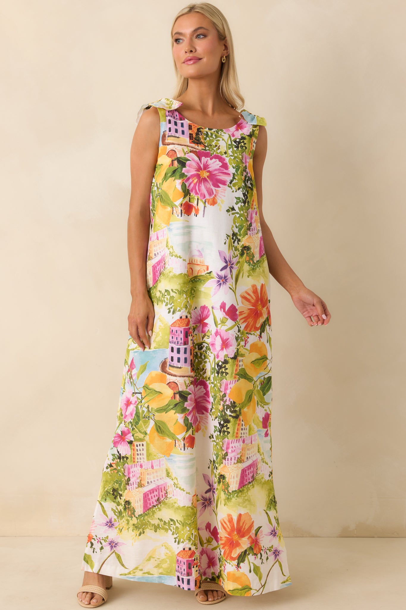 Floral and citrus print maxi dress with easy silhouette and soft shoulder ties.