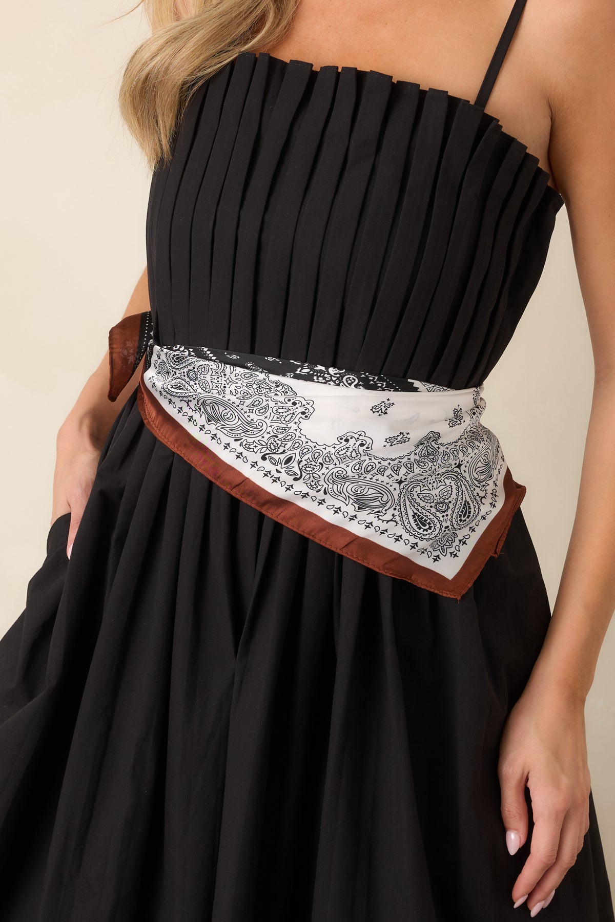 Close-up of the intricate paisley and bandana motifs, highlighting the warm brown, ivory, and black patchwork design.