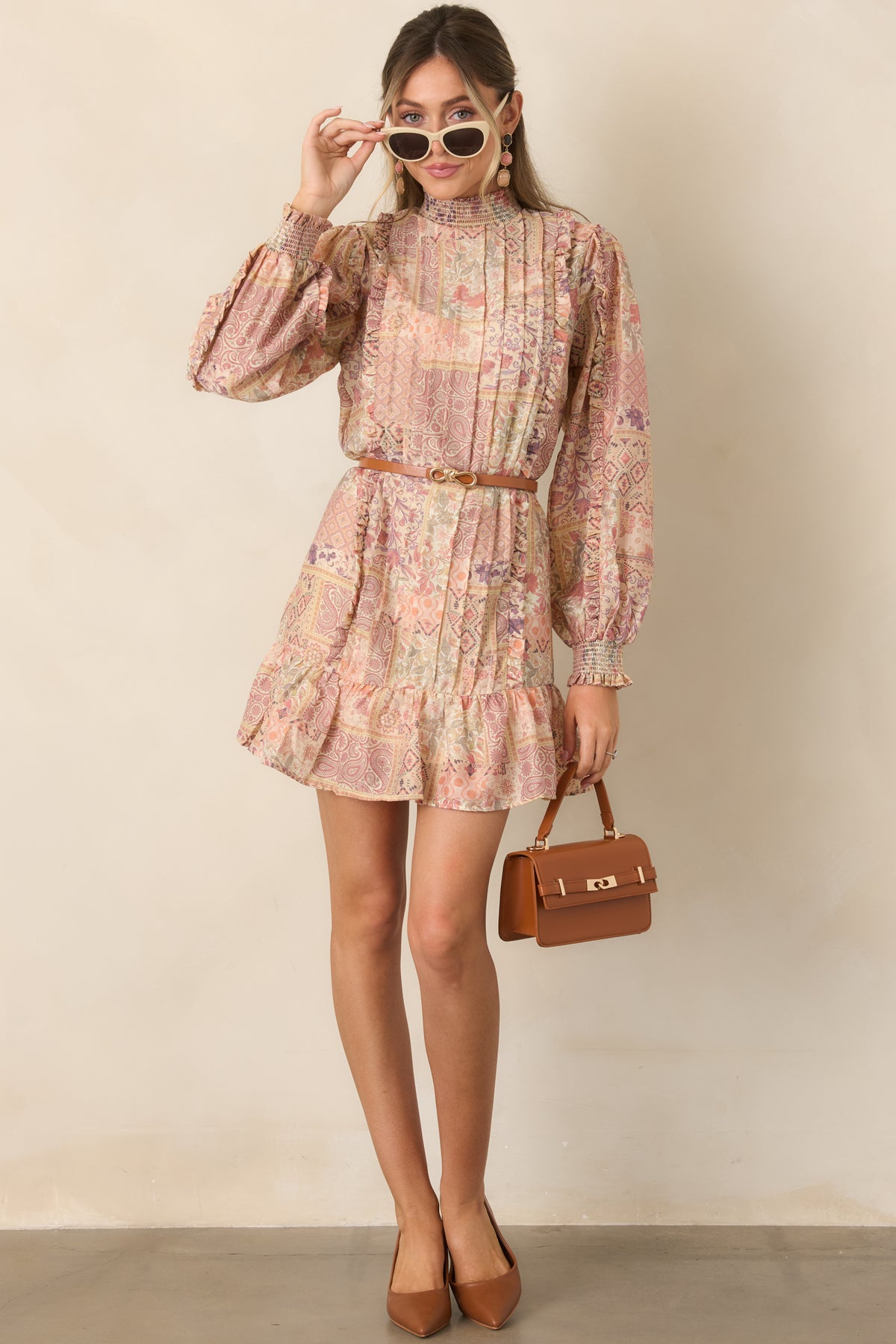 Patchwork mini dress with blush, coral, lavender, sage, and ivory paisley and floral prints.