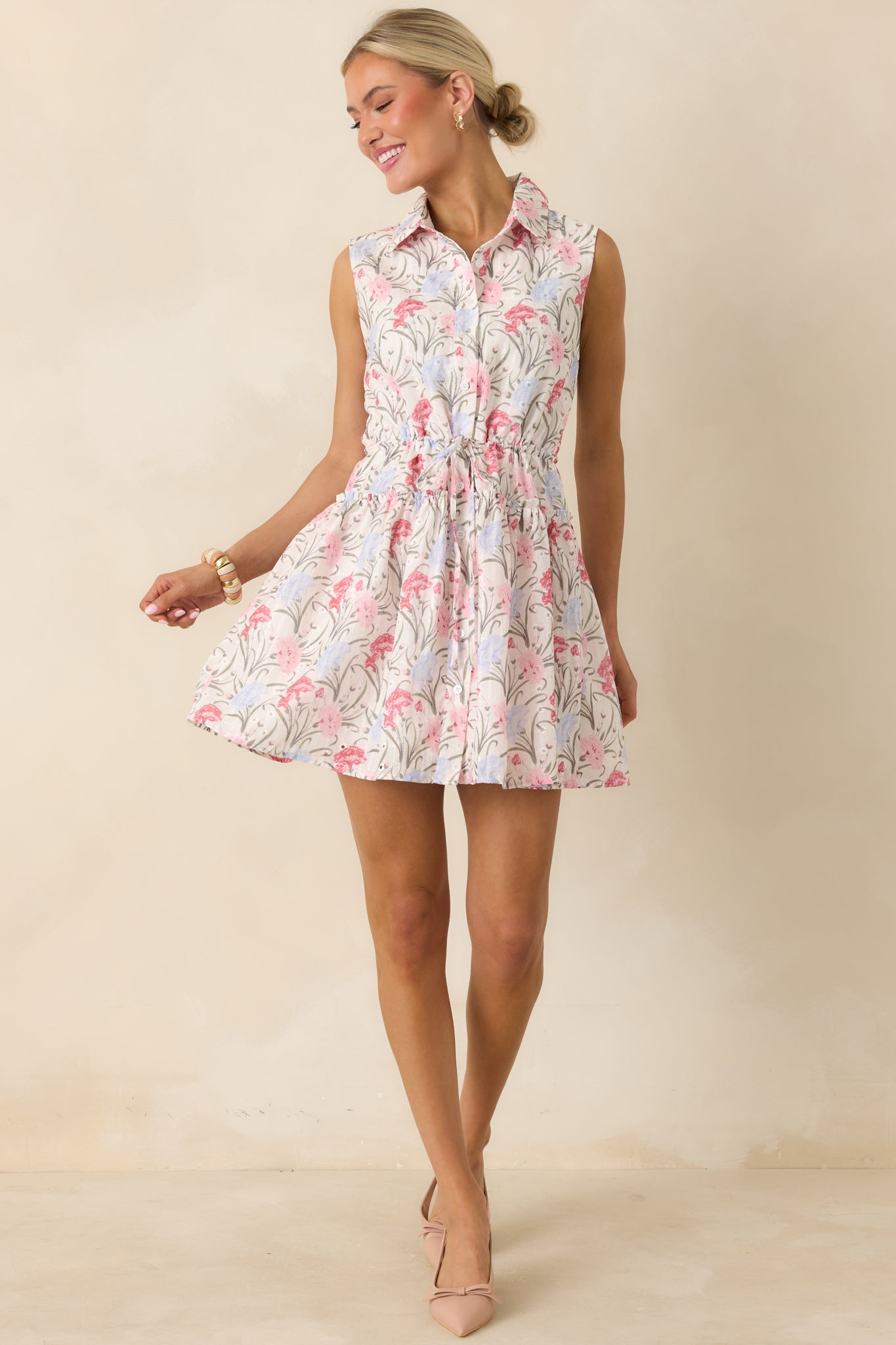 Pink and lavender floral mini dress with collared neckline and partial button front.