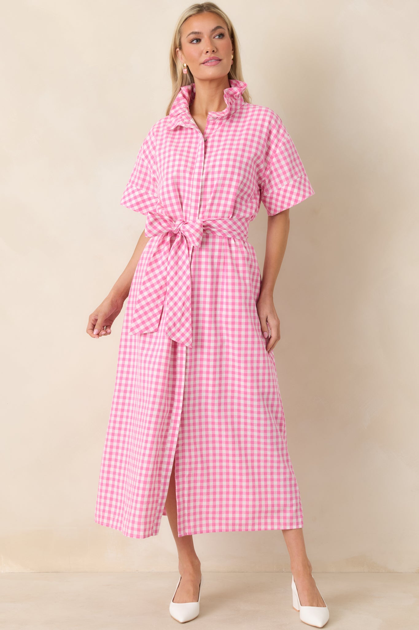 Pink and white gingham maxi dress with a structured ruffle collar, short sleeves, and a button-front placket.