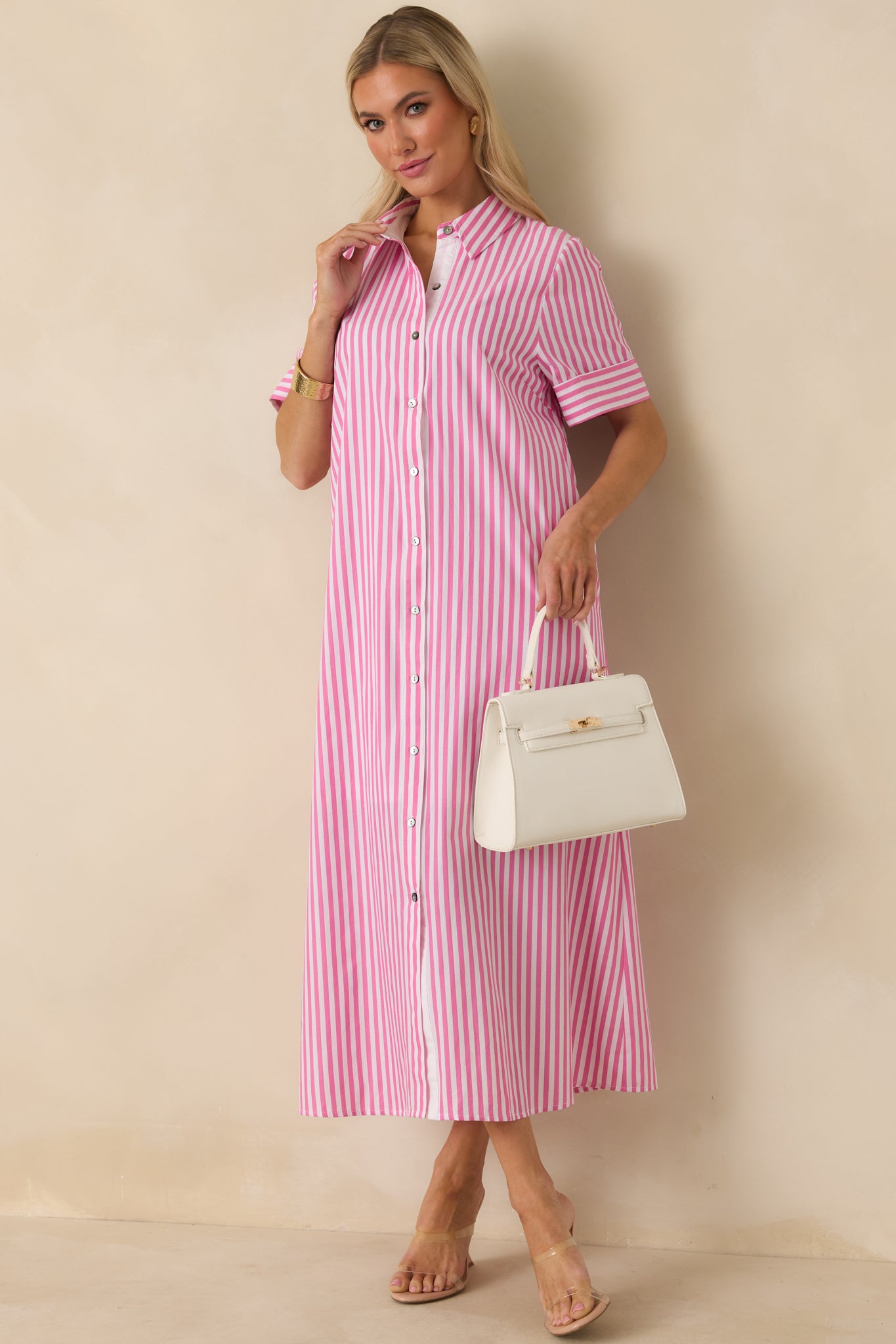 Pink and white maxi shirt dress with short sleeves and straight front silhouette for versatile wear.