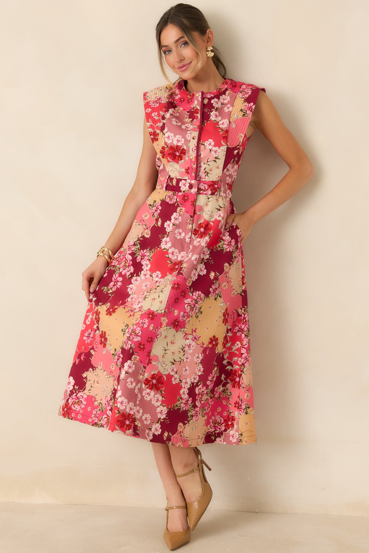 Pink and burgundy floral denim dress with cream and peach accents, belt loops, and functional side pockets.