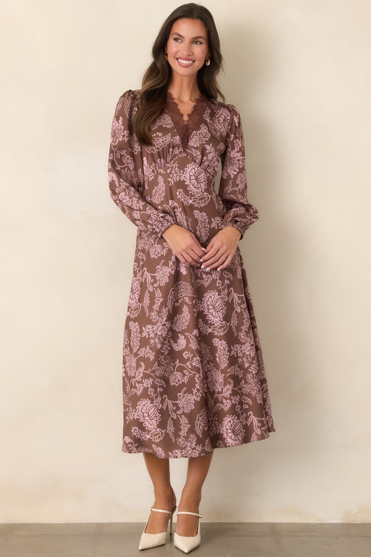 Pink floral lace print dress showcasing the flowing skirt and gently gathered bodice.