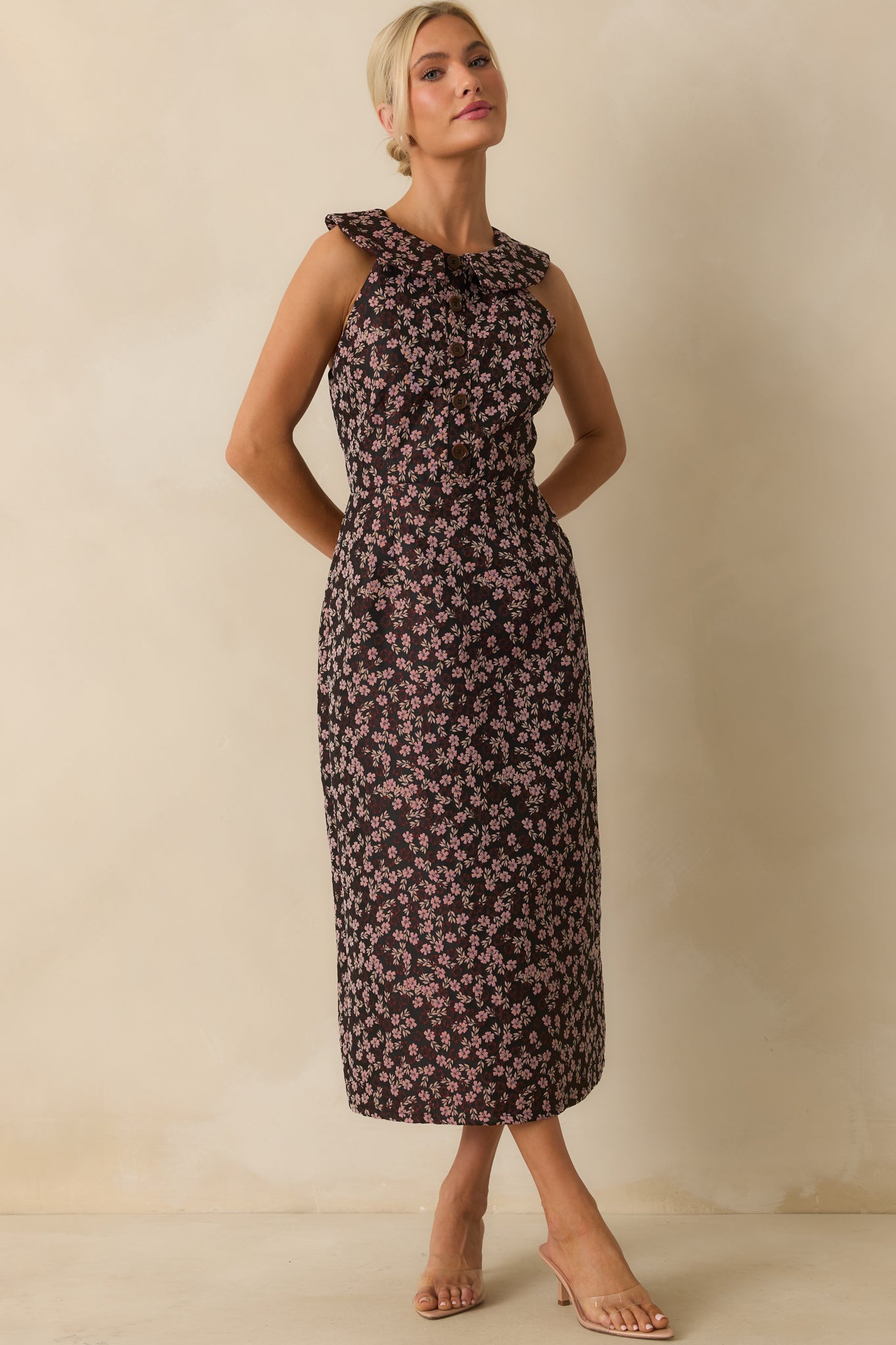 Midi dress with pink floral pattern, collared top, and sleeveless design.