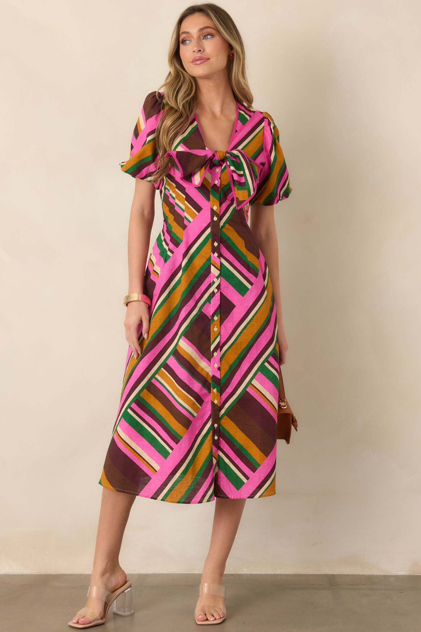 Cotton-linen blend midi dress showcasing bold geometric stripes, a fitted upper bodice, gathered waist, and generously full skirt.