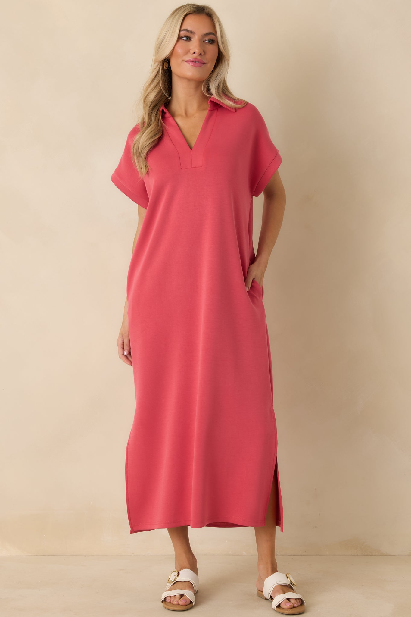 Coral pink midi dress with a notch V-neck collar, soft fabric feel, and effortless everyday silhouette.