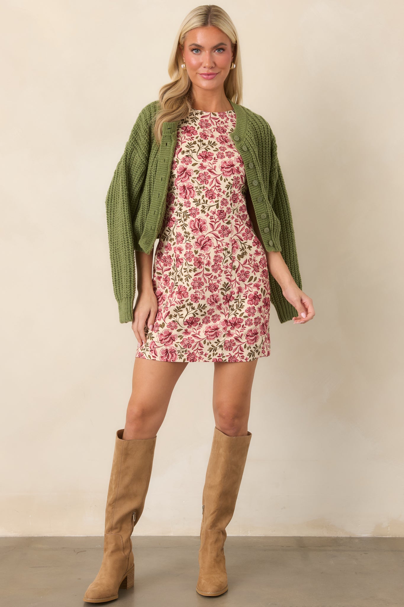 Pink and olive floral mini dress featuring a high rounded neckline, sleeveless cut, fitted silhouette, and vintage-inspired chintz print.