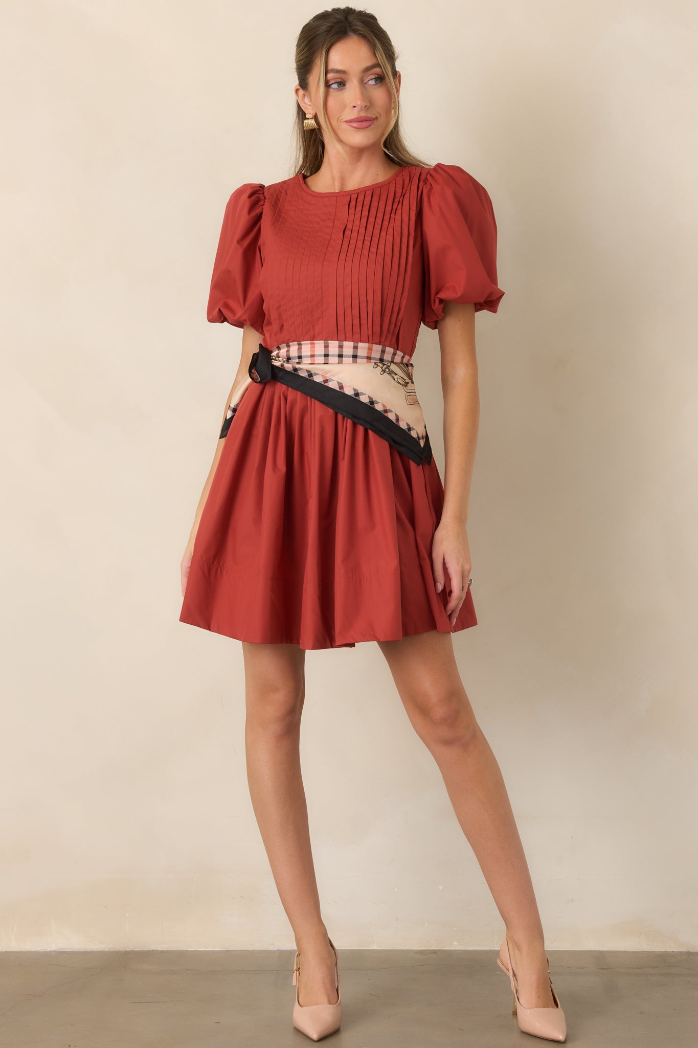Mini dress featuring detailed pintucking across the bodice, voluminous short puff sleeves, and a full softly gathered skirt.
