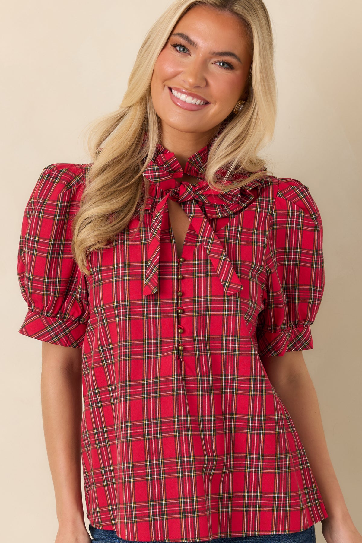 Plaid cotton blouse with short puff sleeves finished with fitted bands and a softly gathered shape.