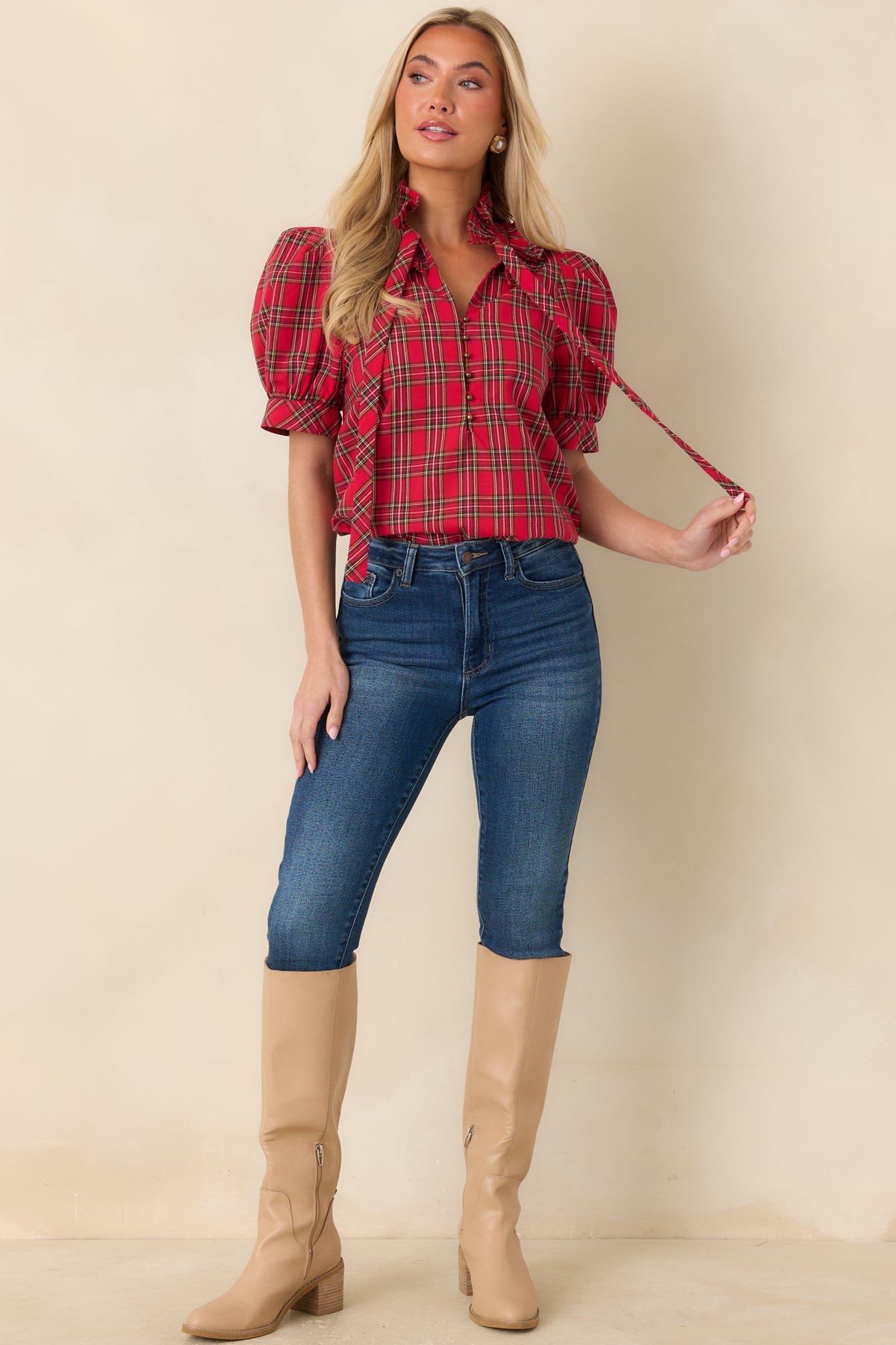 Plaid cotton blouse featuring a ruffled stand collar, matching bow tie, and short puff sleeves with fitted bands.