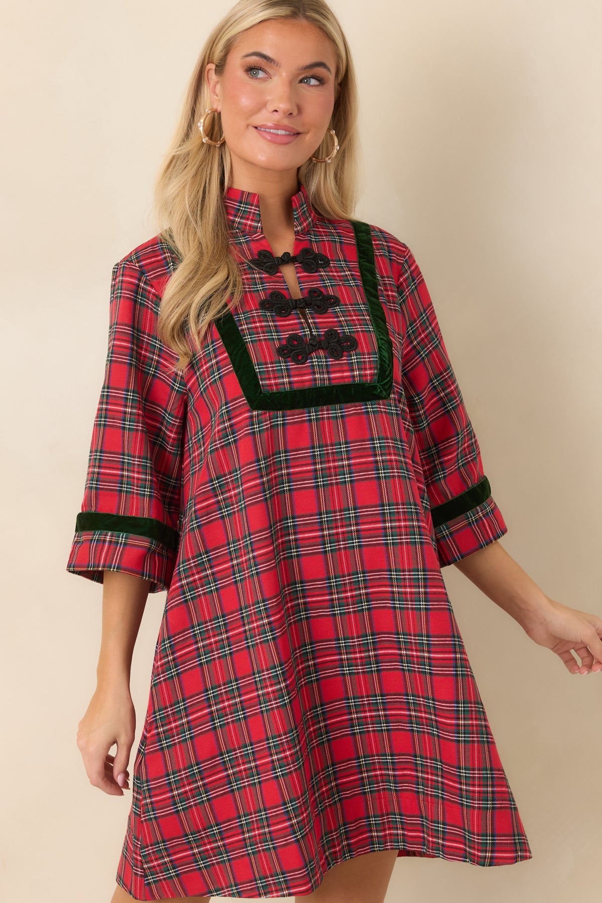 Red and green plaid dress highlighting the dark green velvet trim and black braided frog closures along the front.