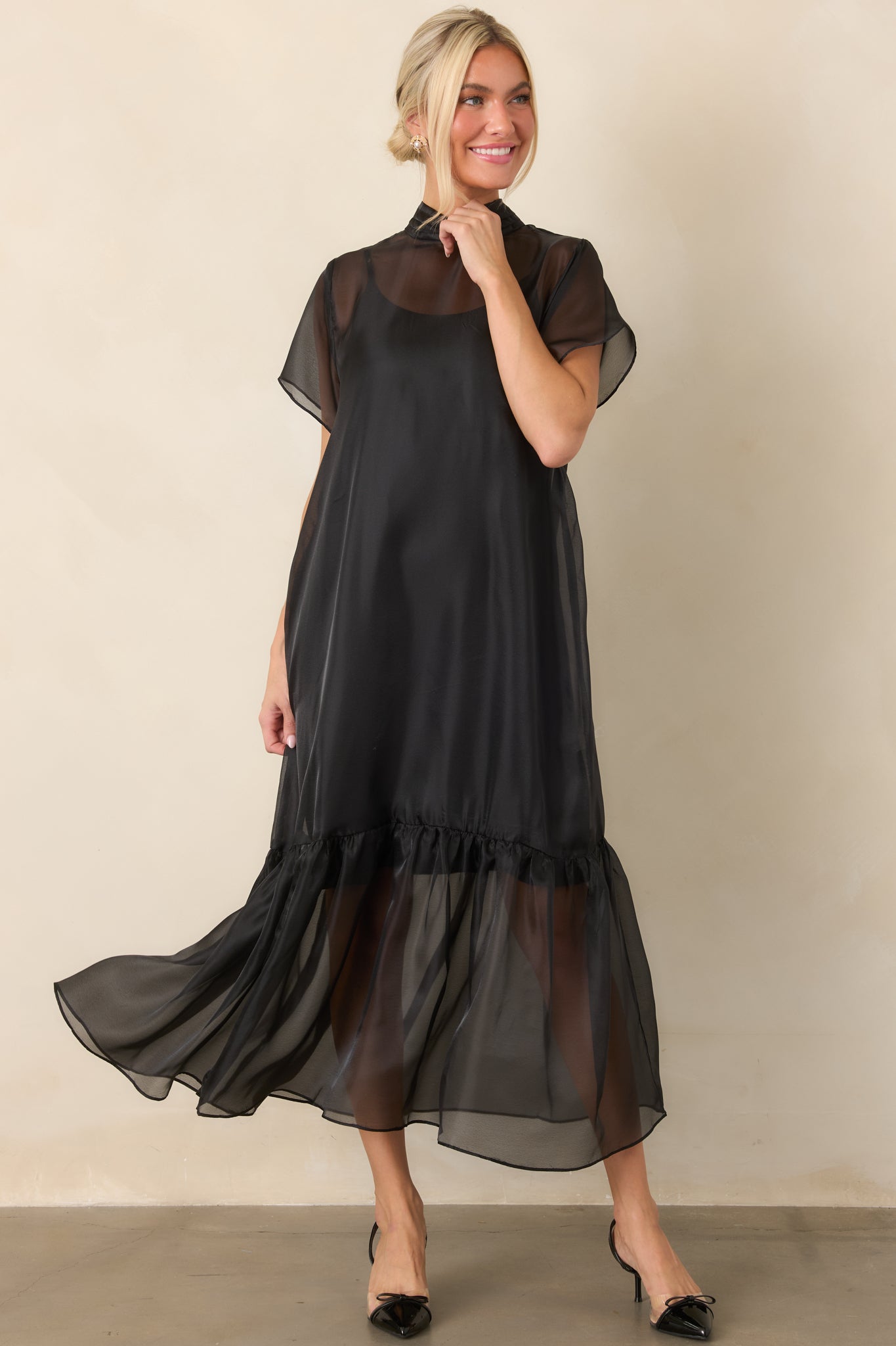 Polished organza maxi dress featuring layered construction, a pleated high neckline, and gathered detailing that creates soft volume through the skirt.