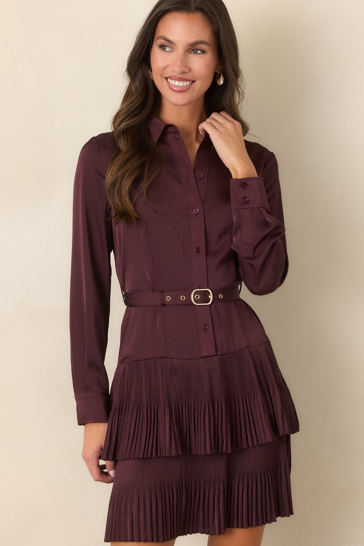 Plum dress highlighting the pointed collar and tonal buttons along the front closure.