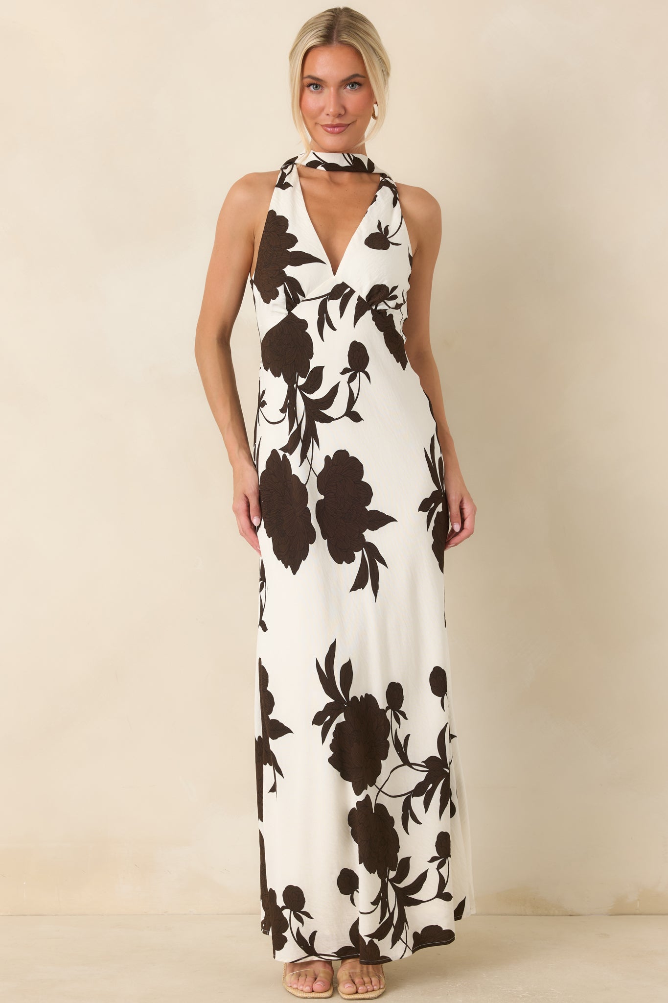 Elegant maxi dress showcasing a plunging neckline, smooth lining, and flattering body-skimming silhouette.