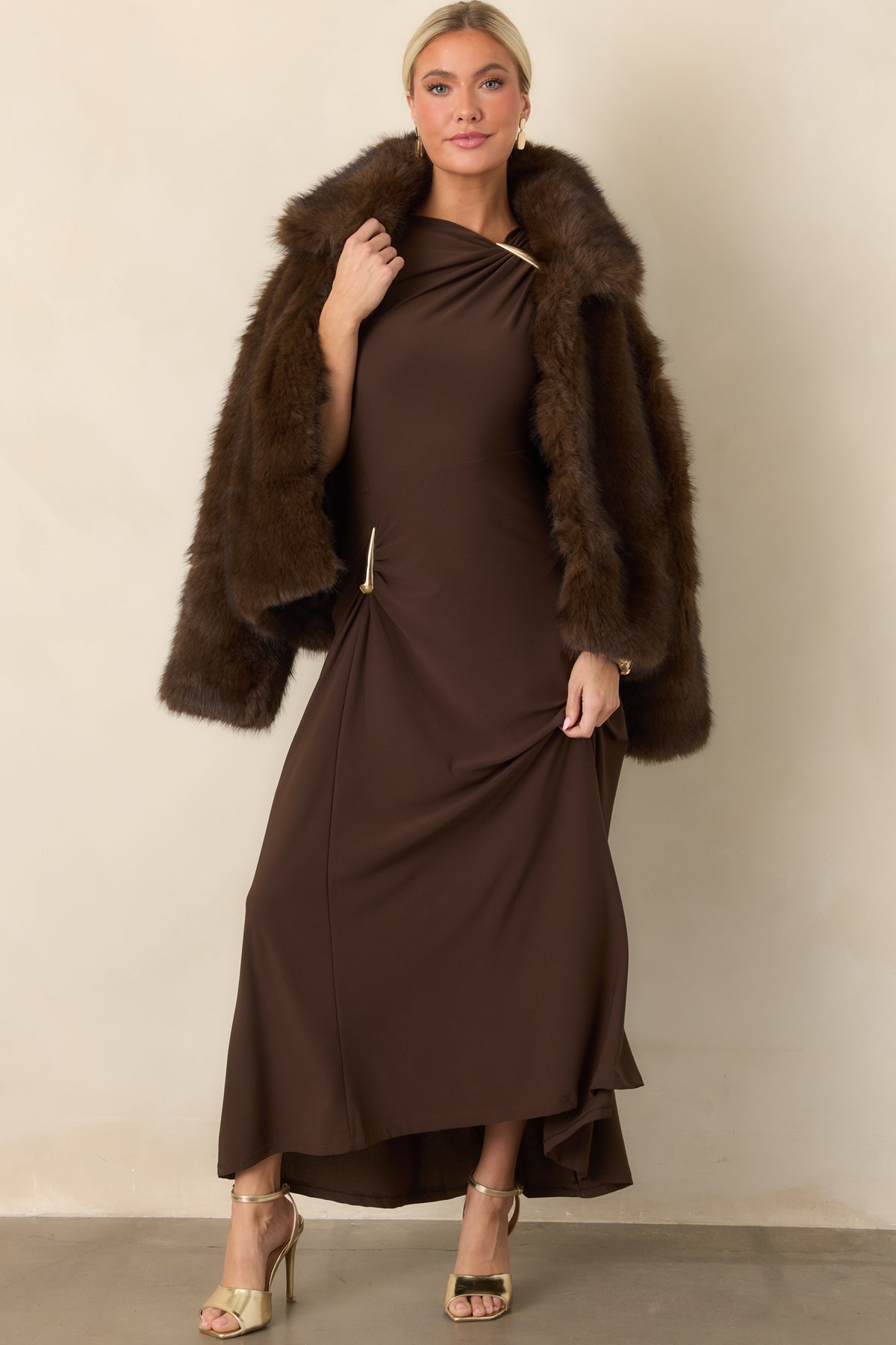 Plush faux fur jacket with a generous collar, three front hook closures, and an easy layering silhouette.