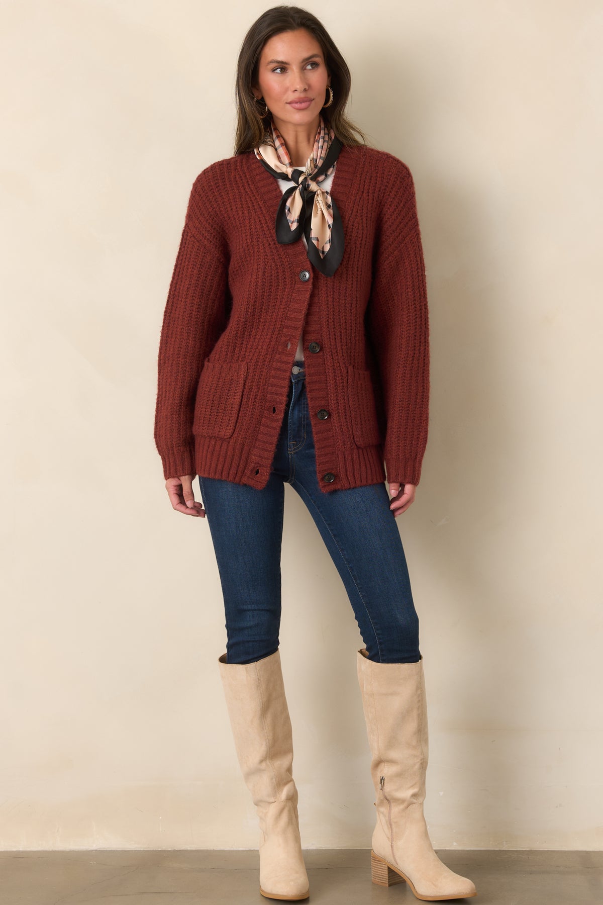 Plush mixed-fiber knit cardigan featuring an open V-neckline, dark button front, dropped shoulders, and oversized silhouette.