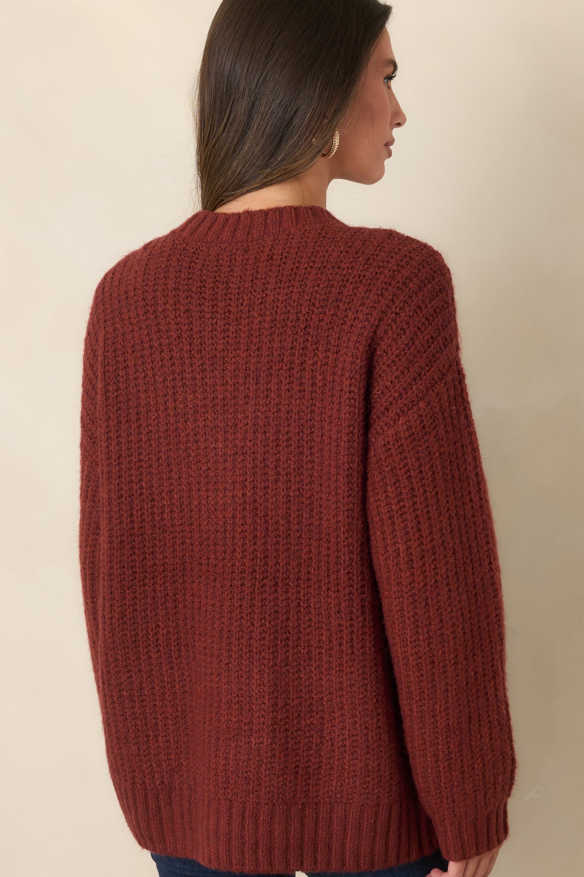 Rear view of the plush knit cardigan showing the dropped shoulders, oversized silhouette, long sleeves, and straight hip-length hem.
