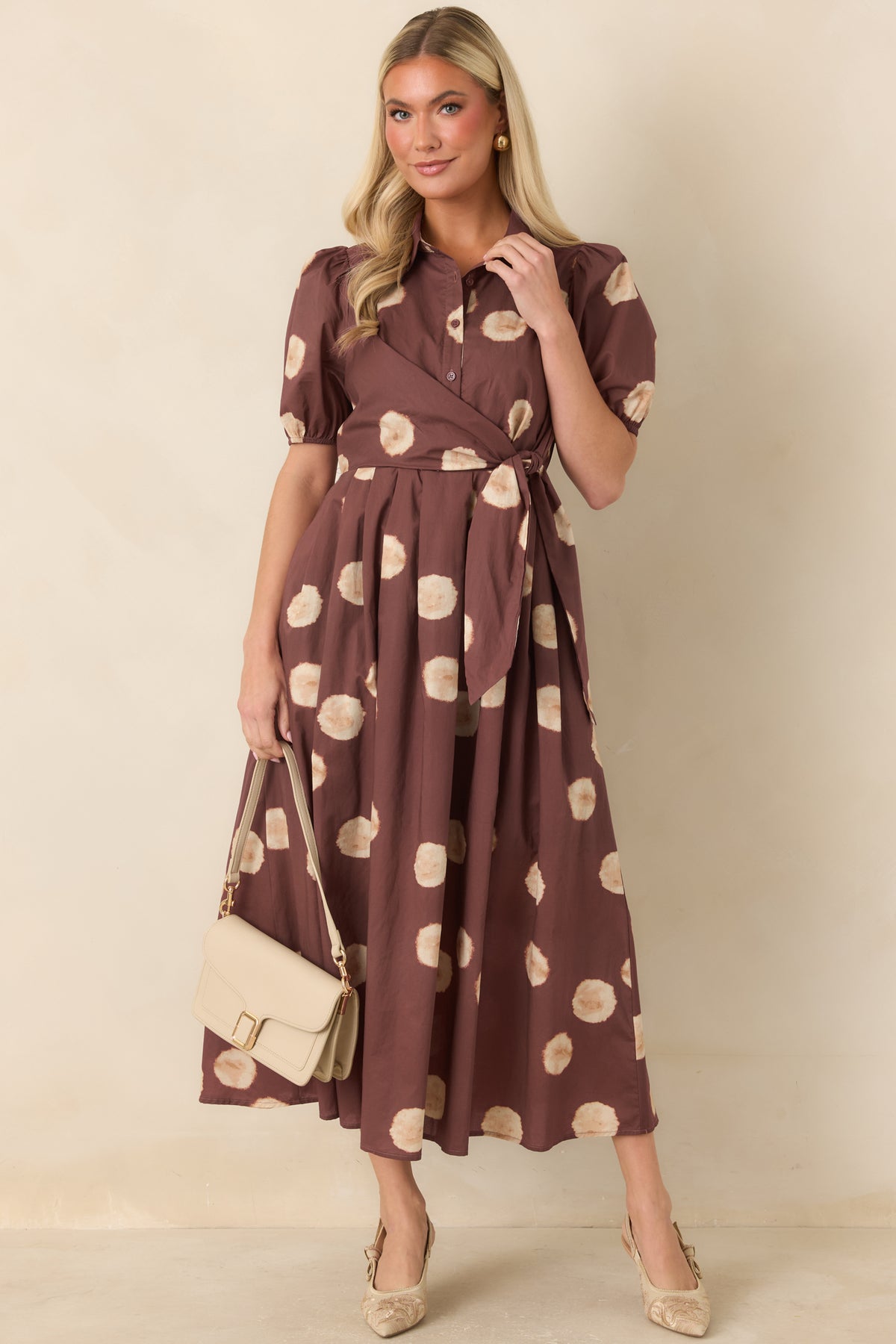 Printed cotton dress featuring a functional button-front bodice and convenient side pockets.