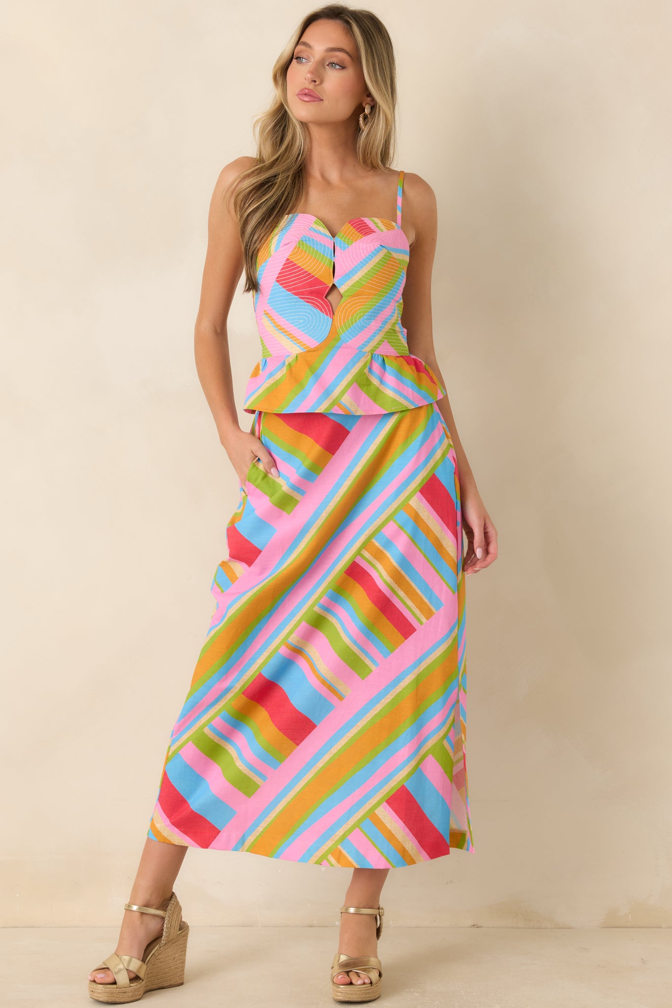 Lightweight cotton-linen midi skirt showcasing a geometric pattern, side slit, side pockets, and a flowing silhouette.
