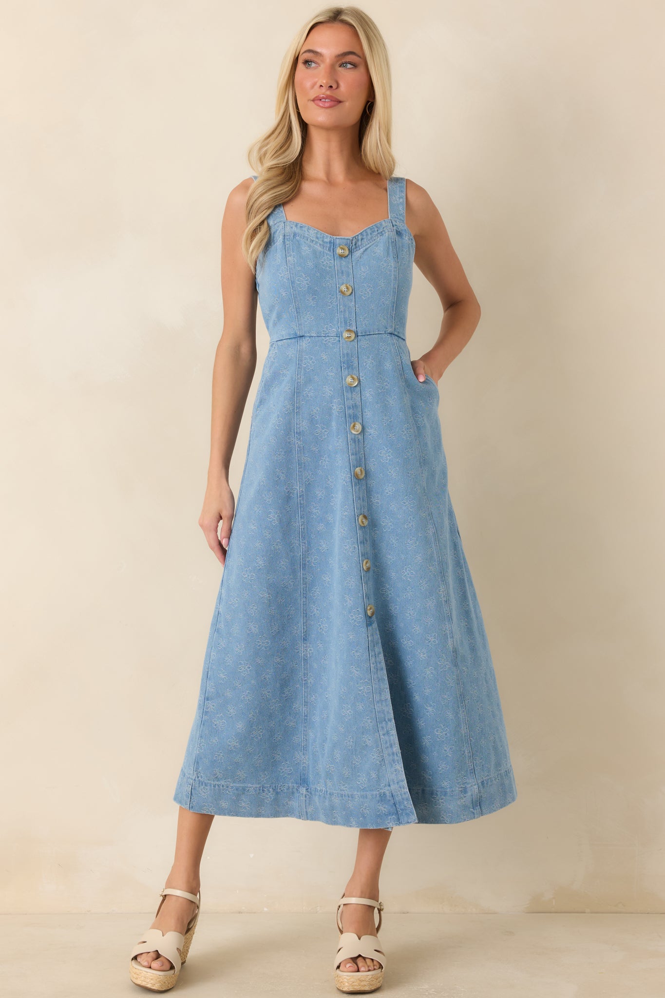 Printed dress with a sweetheart neckline, adjustable shoulder straps, and relaxed A-line design.