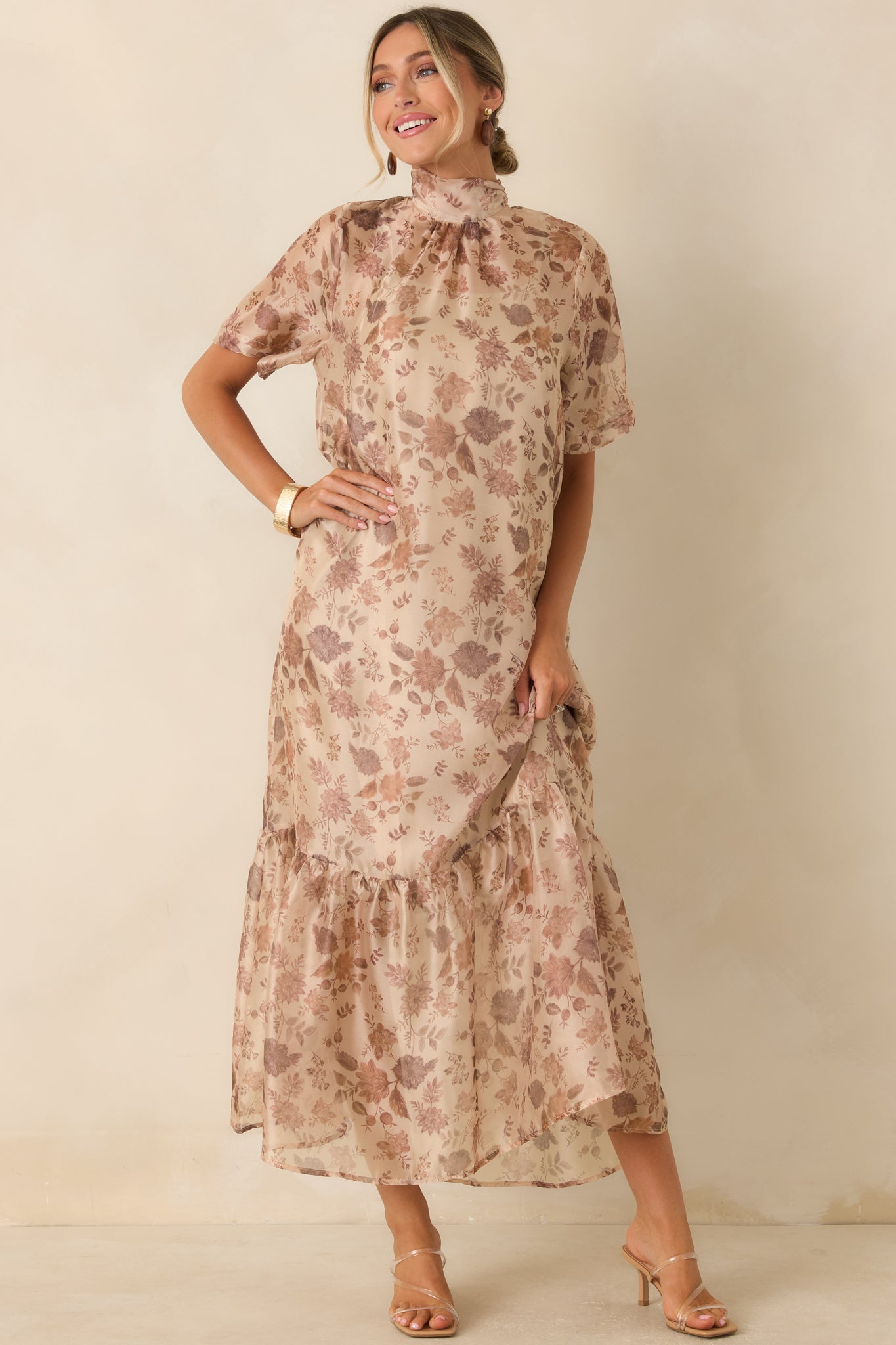 Printed maxi dress with a delicate sheer overlay, flared A-line shape, and romantic tiered hem detailing.