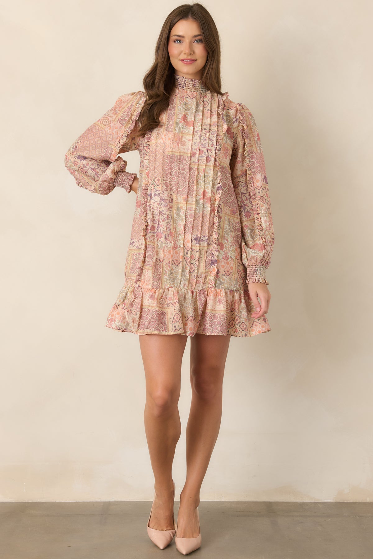 Printed mini dress with a smocked high neckline and relaxed silhouette.