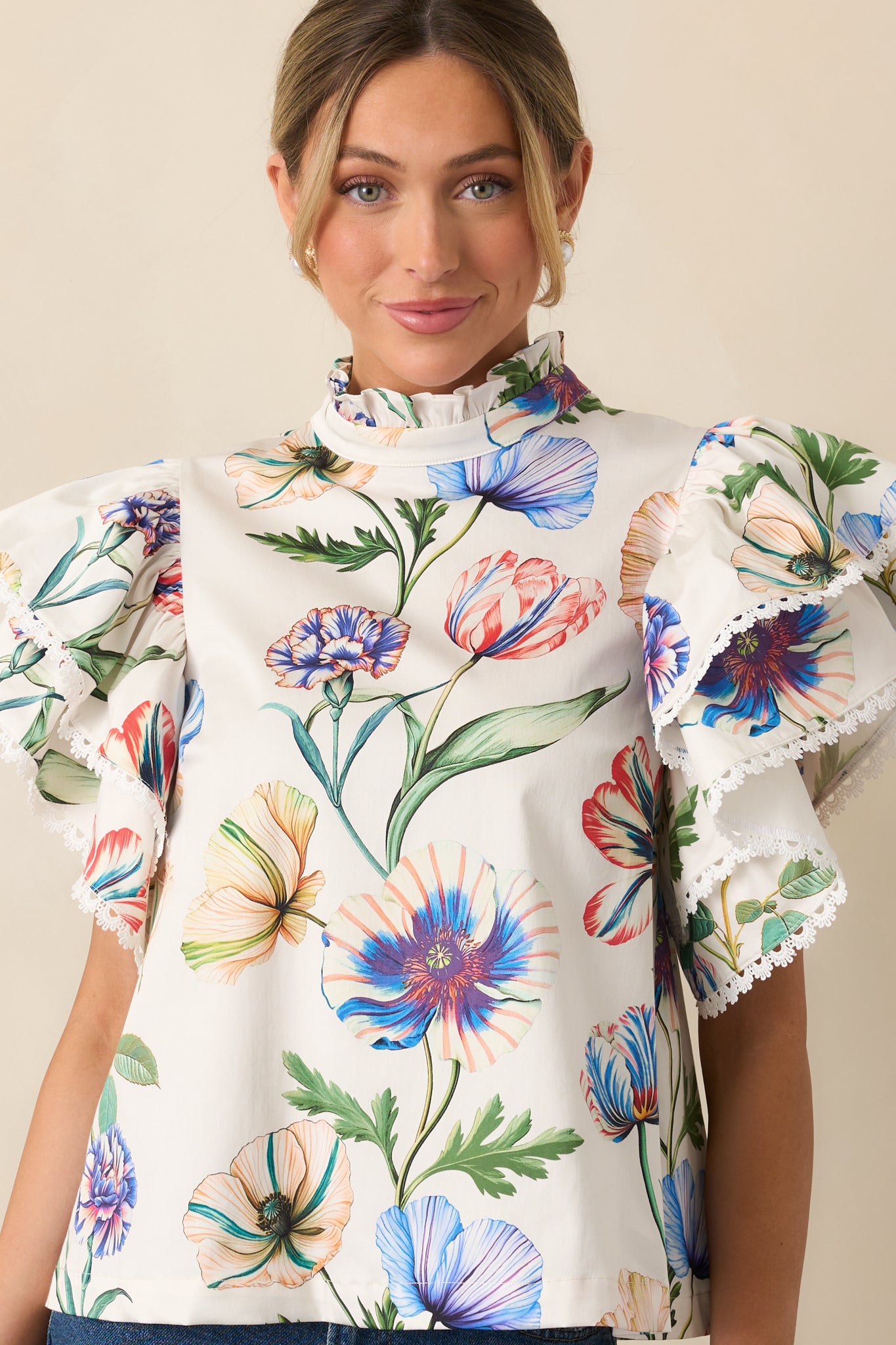 Cropped look showing short ruffle sleeves and multicolor floral print.