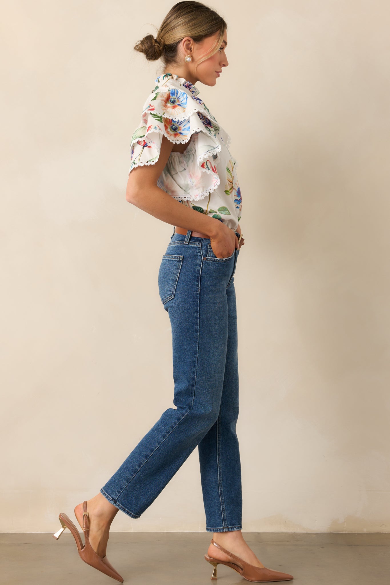 Floral top with soft, airy fit, decorative ruffle accents, and relaxed silhouette.