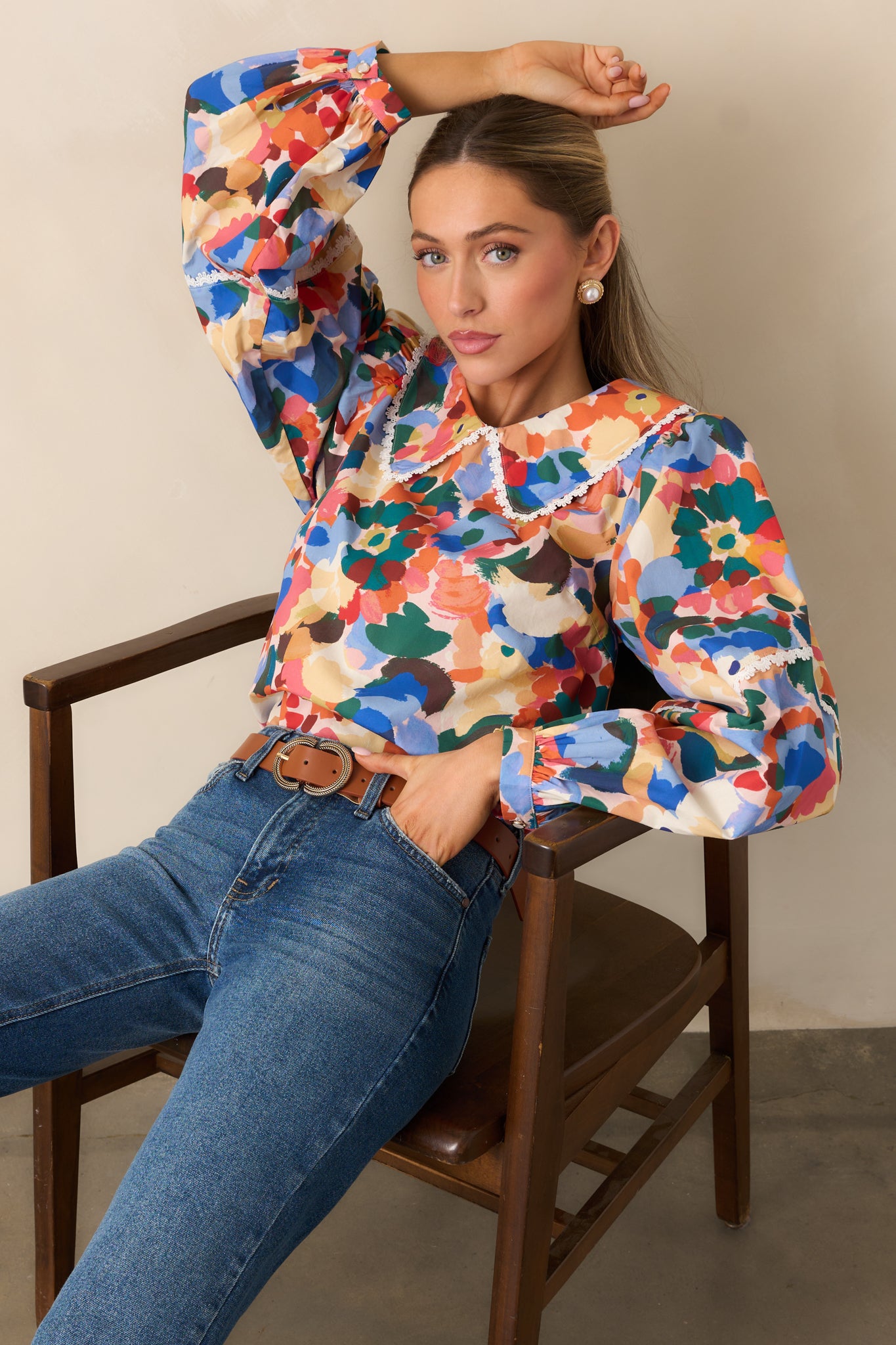 Prosperina floral top featuring eyelet lace trim and a relaxed, flowing silhouette.