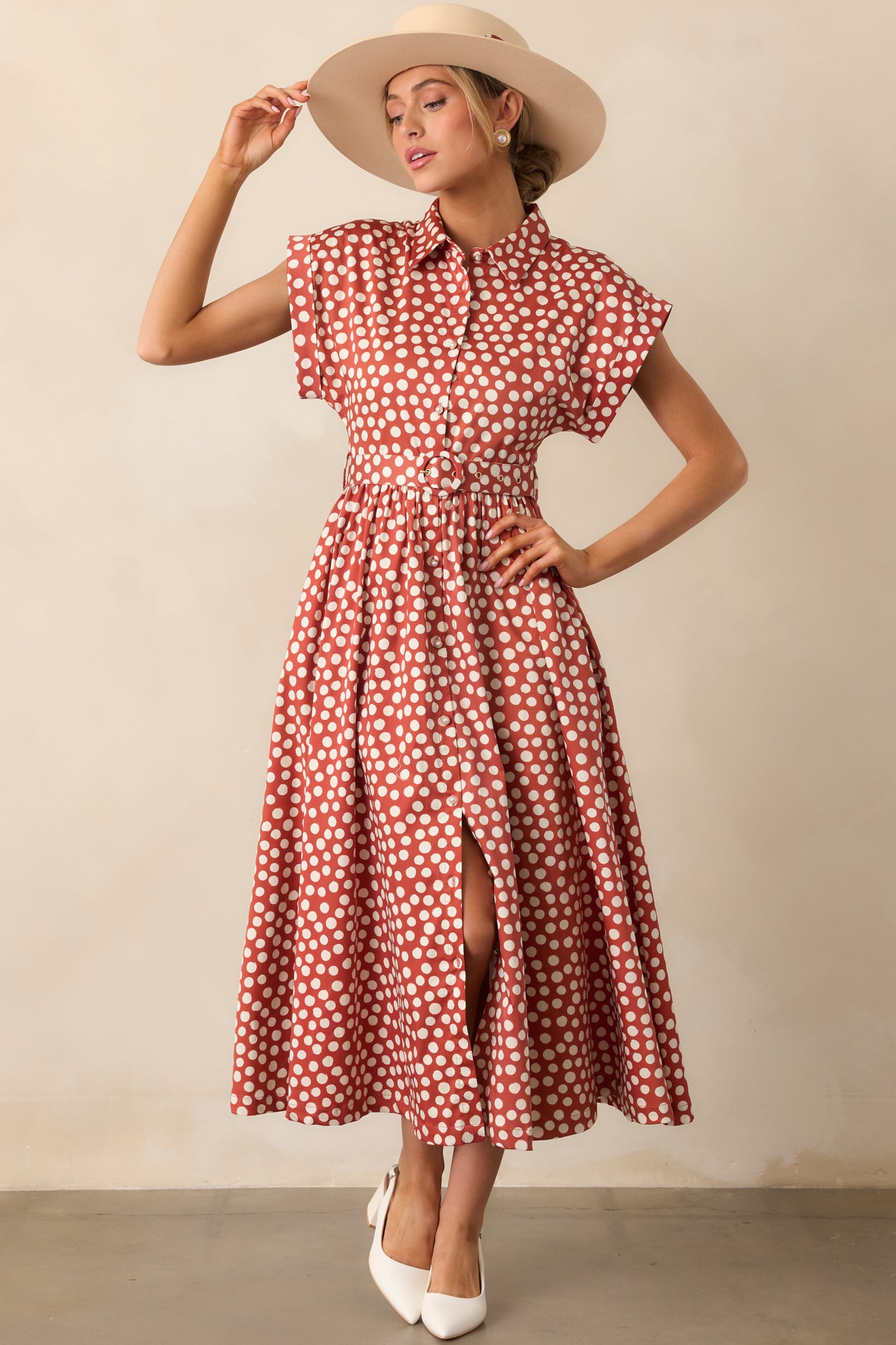 Brick red maxi dress dotted in ivory, complete with pockets that blend function with charm.