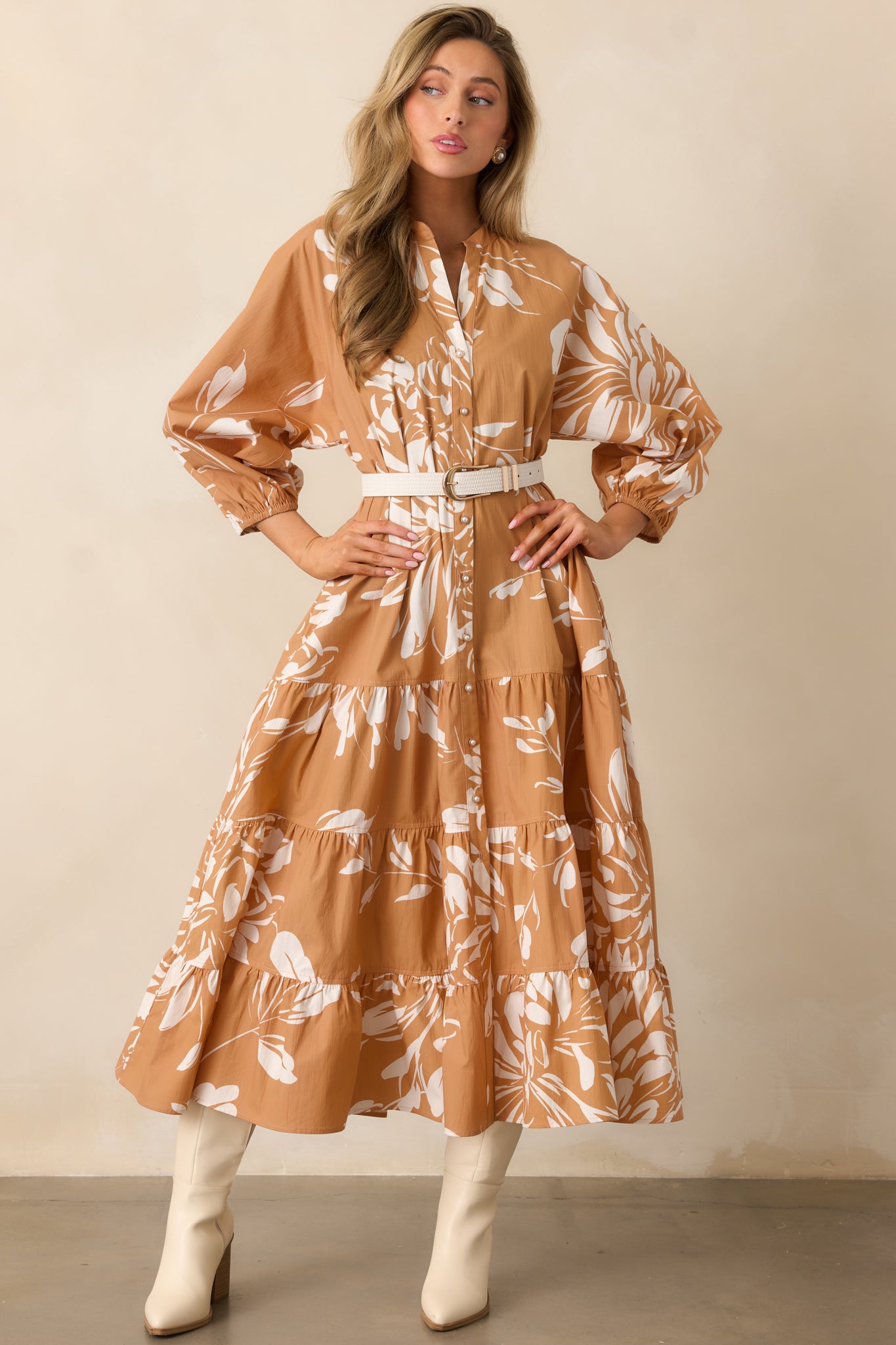 Maxi dress with notch v-neck, functional side pockets, and flowing tiers in soft floral print.