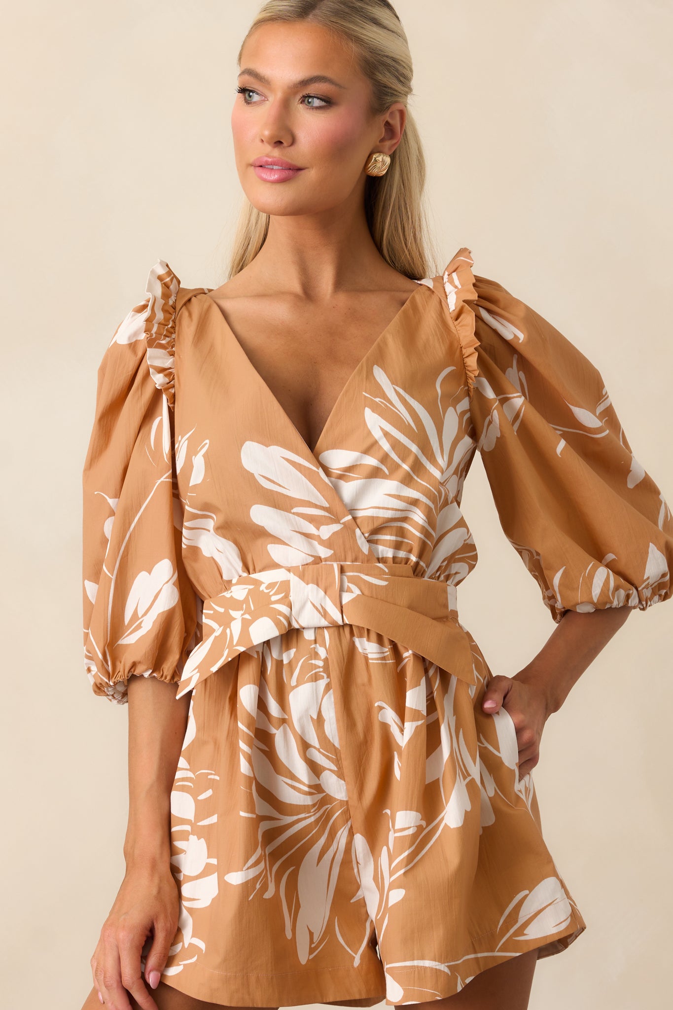Cropped look showing ruffle shoulder trim and half-length sleeves with elastic cuffs.