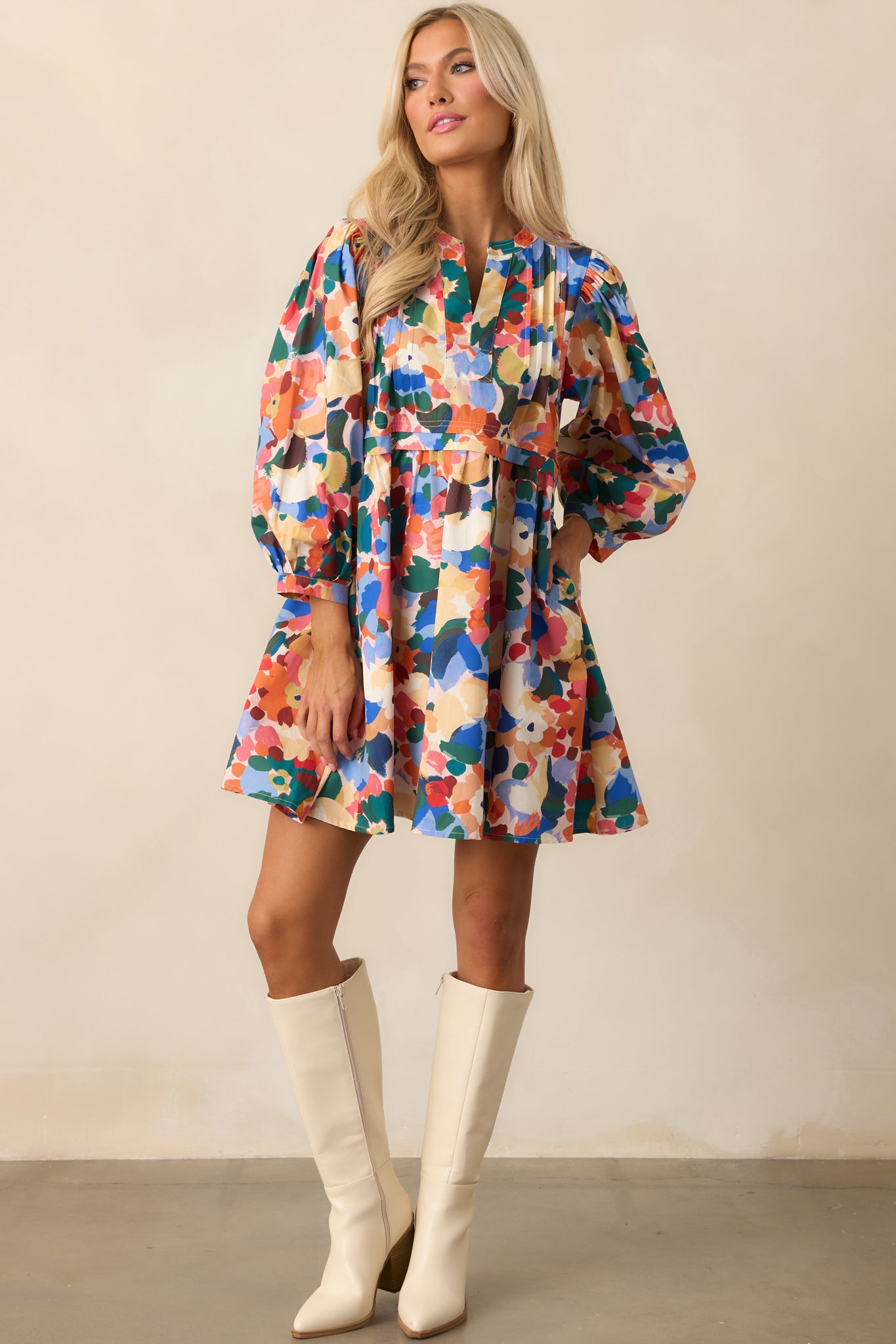 Prosperina floral mini dress featuring pintuck pleat detailing on the front and functional side pockets.